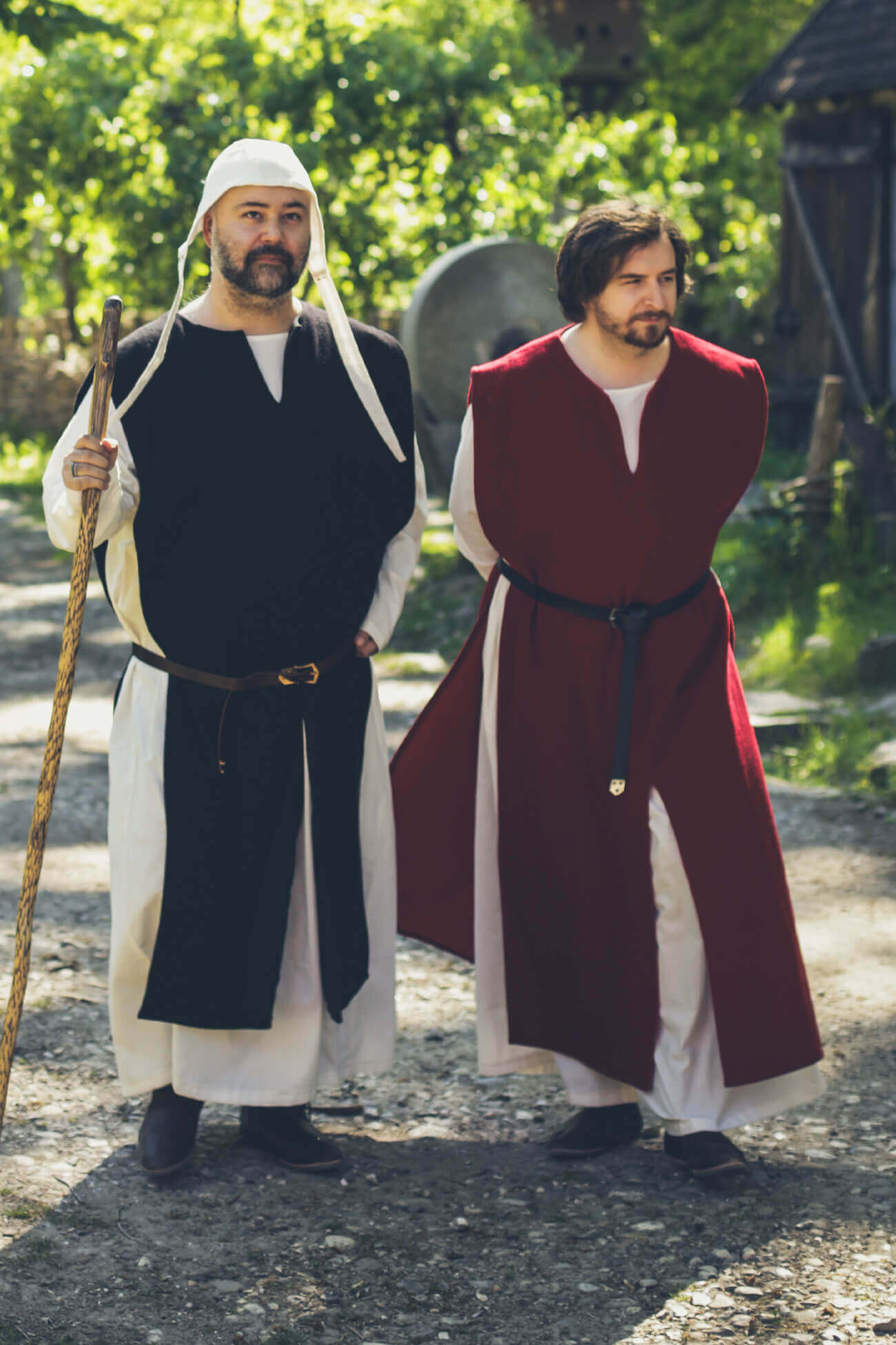 two men dressed in high medieval clothing