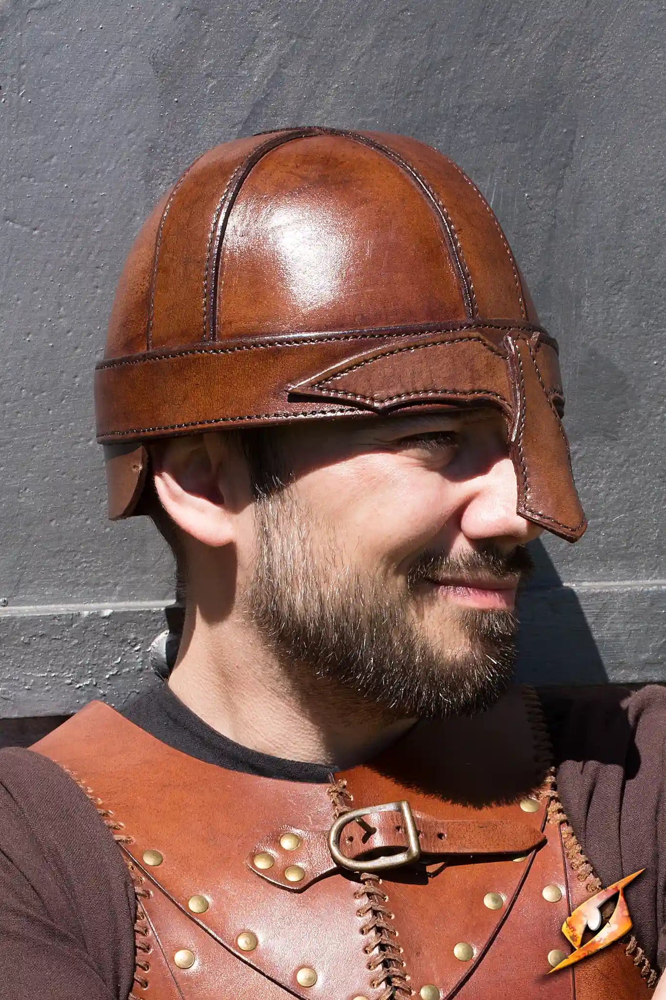 Warrior Helmet made of thick ox brown leather, showcasing a Spangenhelm design and front face protection.