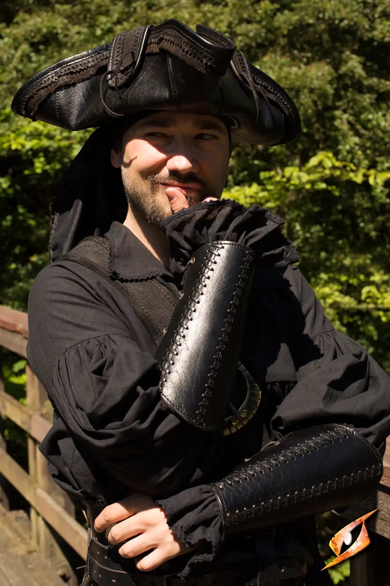 Man wearing Bracers Squire leather armguards in a costume, ideal for combat protection.