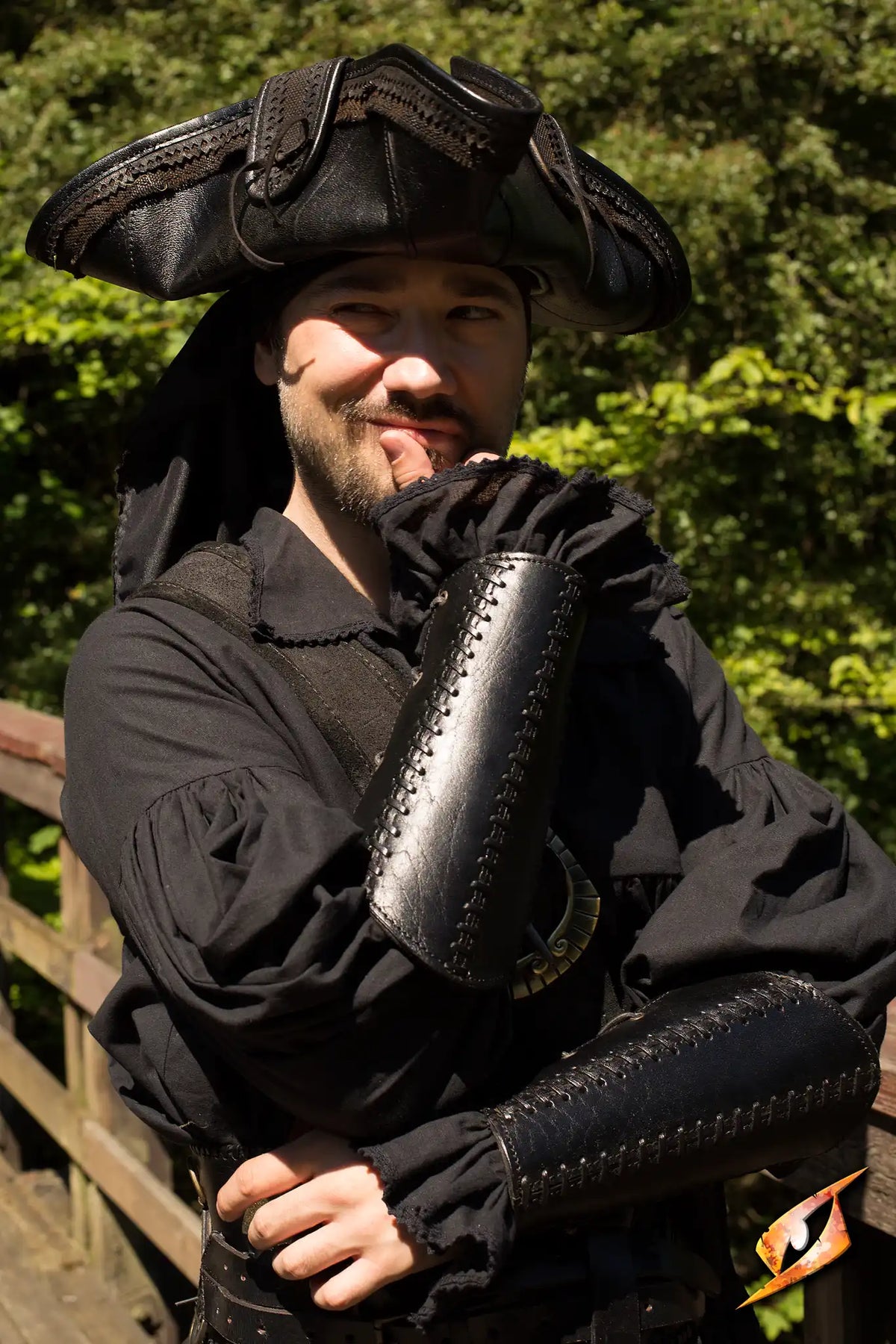 Man wearing Bracers Squire leather armguards in a costume, ideal for combat protection.