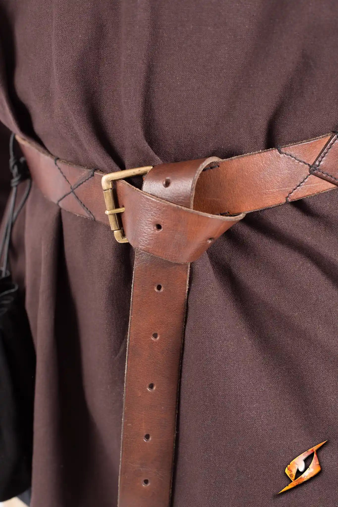 Close-up of X-Belt made from quality leather, featuring a buckle and stylish design, perfect for outdoor adventures.