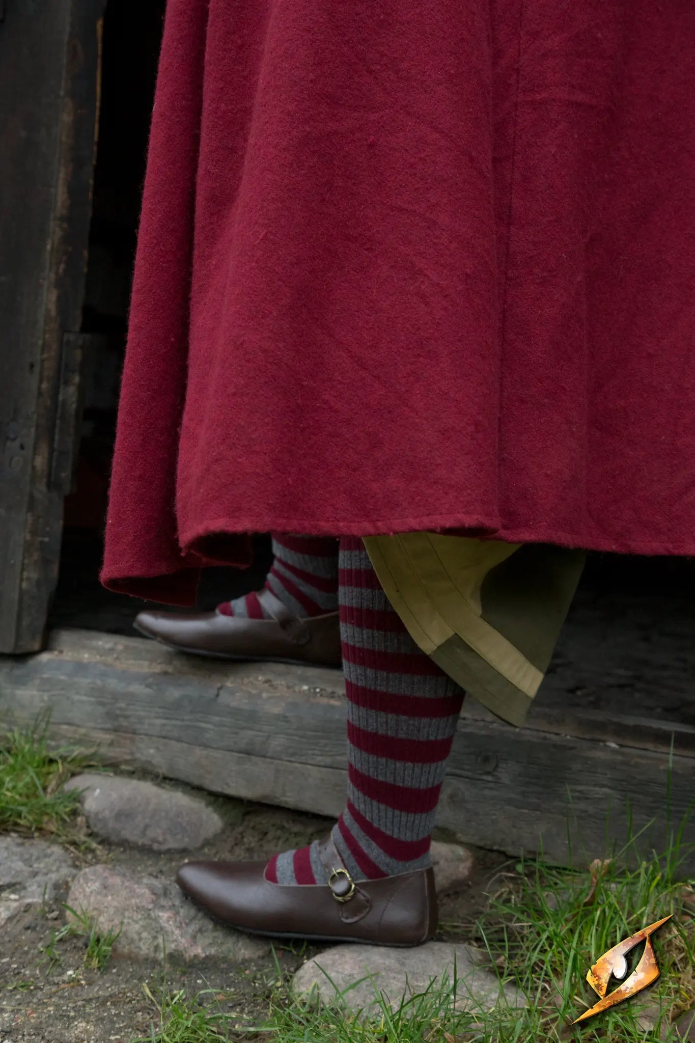 Shoes Astrid worn with striped socks, showcasing classic style and comfort on cobblestone streets.