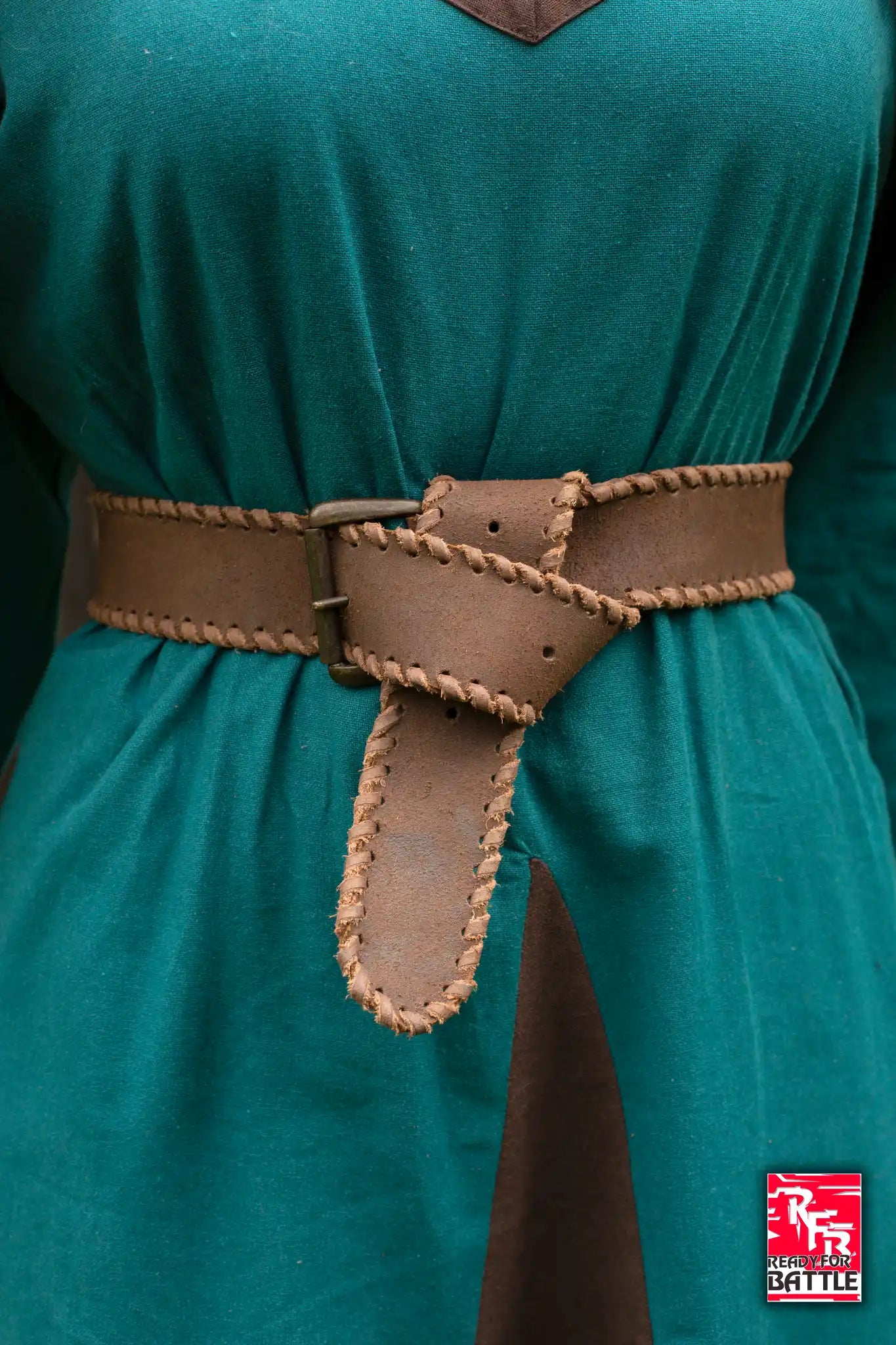 RFB Laced Belt displayed on a green garment, featuring a unique laced design and a sturdy buckle.