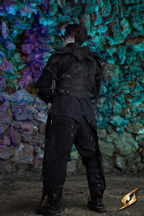 Shadow Armour Set - Suede worn from the back, showcasing its intricate detailing against a textured stone backdrop.