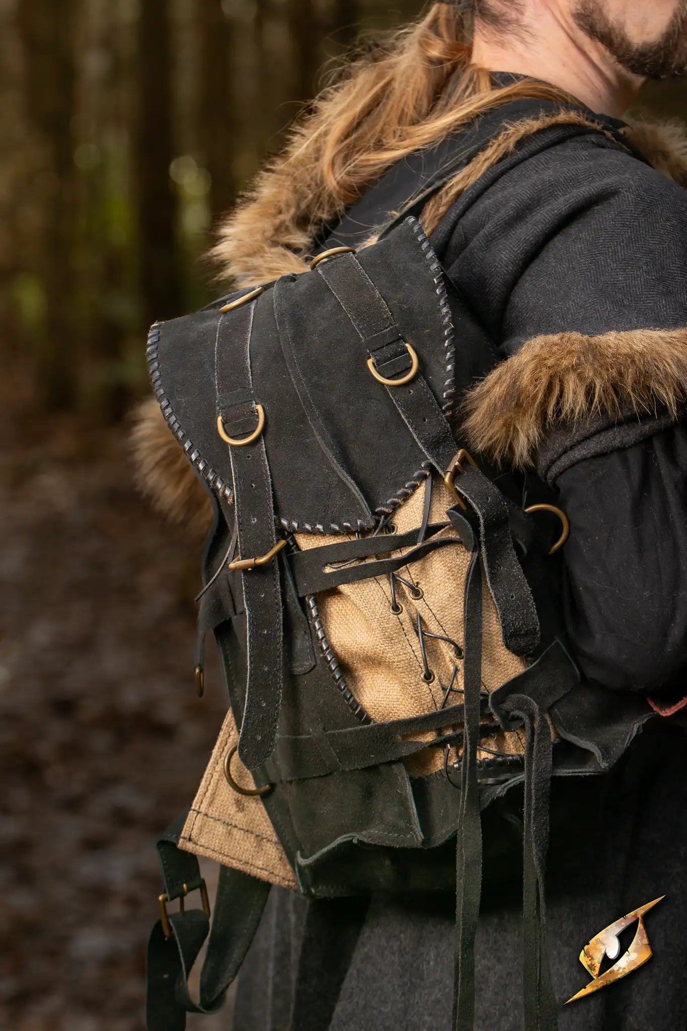 Adventurer Backpack - Suede showcased on a person in a forest setting, perfect for exploration and outdoor adventures.