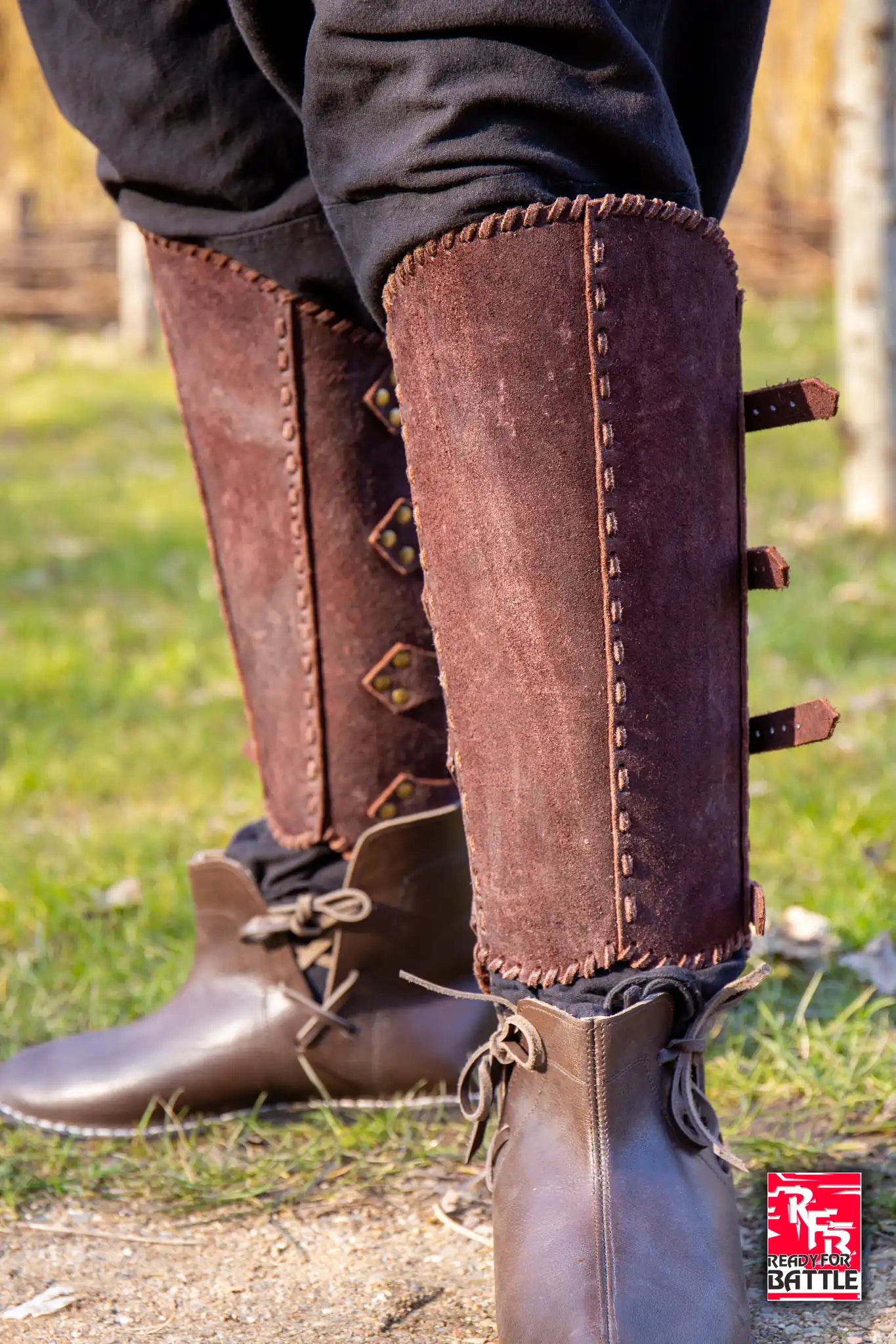 RFB Veteran Greaves protecting legs with elegant leather design in an outdoor setting.