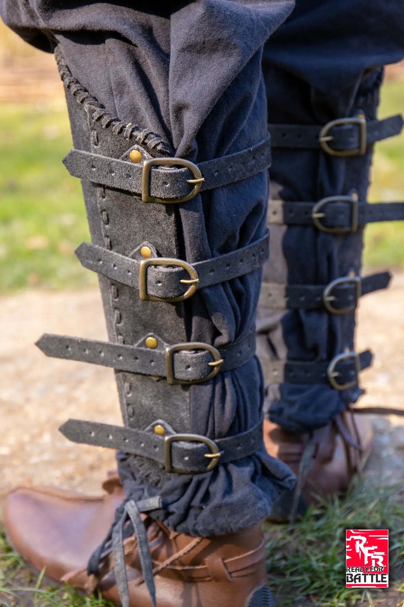 RFB Veteran Greaves displayed on a leg, showcasing the sturdy leather design and buckle details.