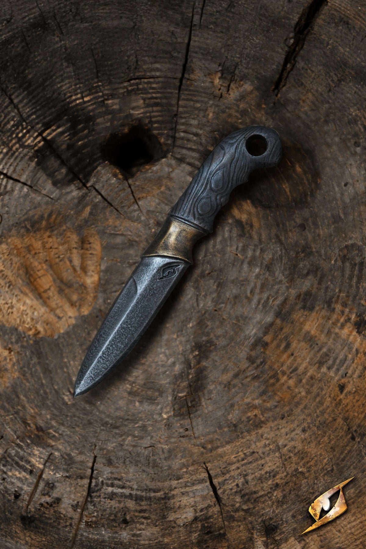 Woodsman Knife - 23 cm resting on a wooden surface with a rustic texture.