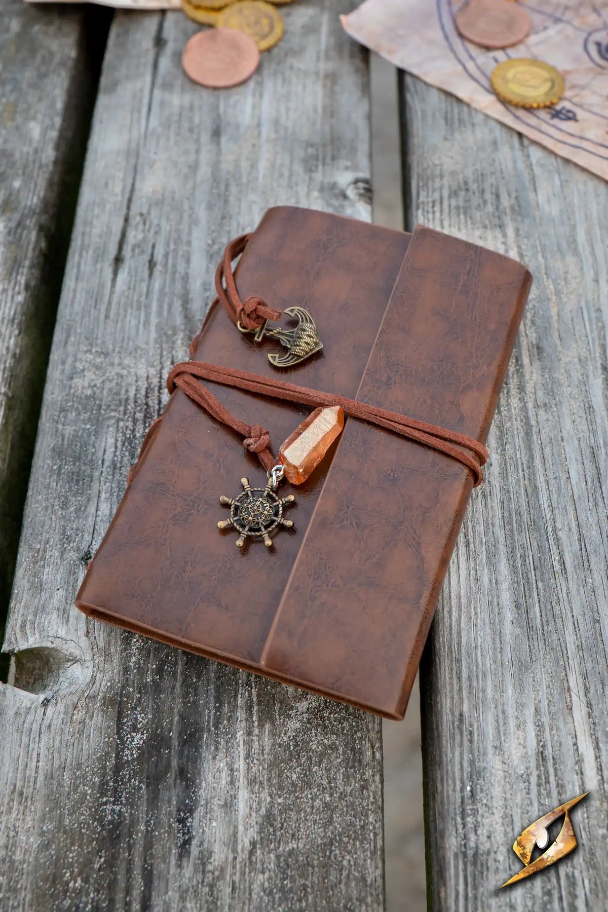 Sailor's Diary featuring a rustic leather cover and nautical charm, set on a wooden table with coins.
