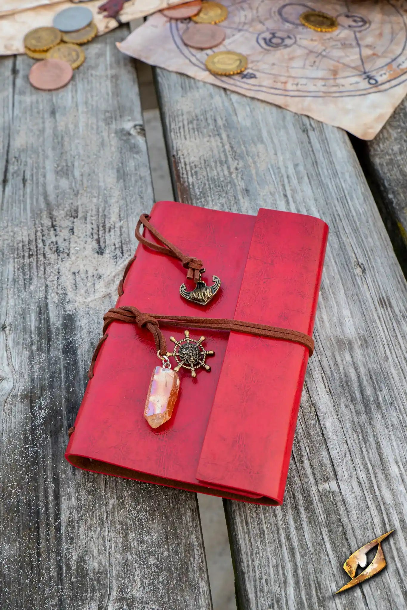 Sailor's Diary with nautical charms, resting on a rustic wooden surface surrounded by coins and maps.