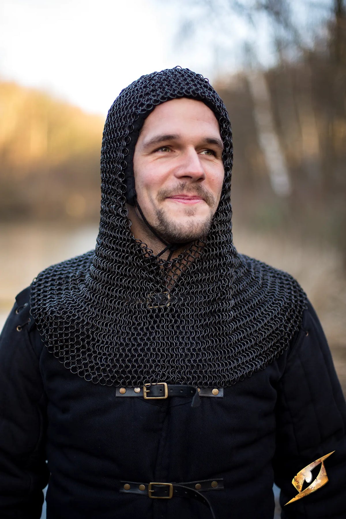 Man wearing a Chainmail Hood - Alaric, showcasing its protective features and stylish design in an outdoor setting.