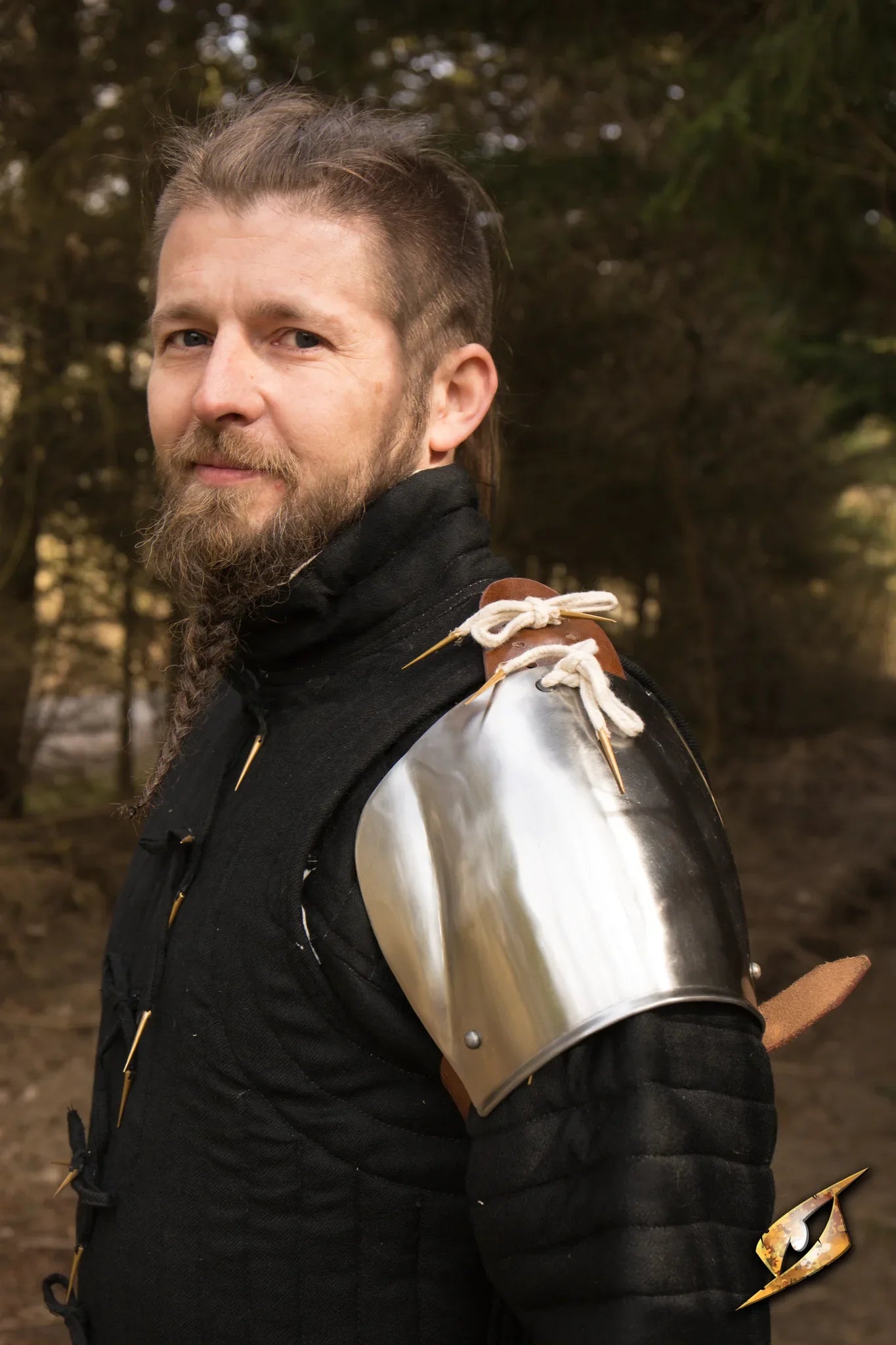 Churburg Shoulders displayed on a medieval armor, showcasing shine and secure fastening for protective wear.