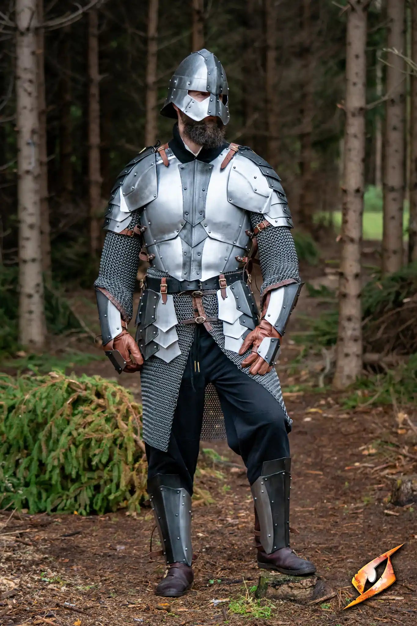 Warrior wearing the Dreki Set armor in a forest setting, showcasing durability and a rugged design.