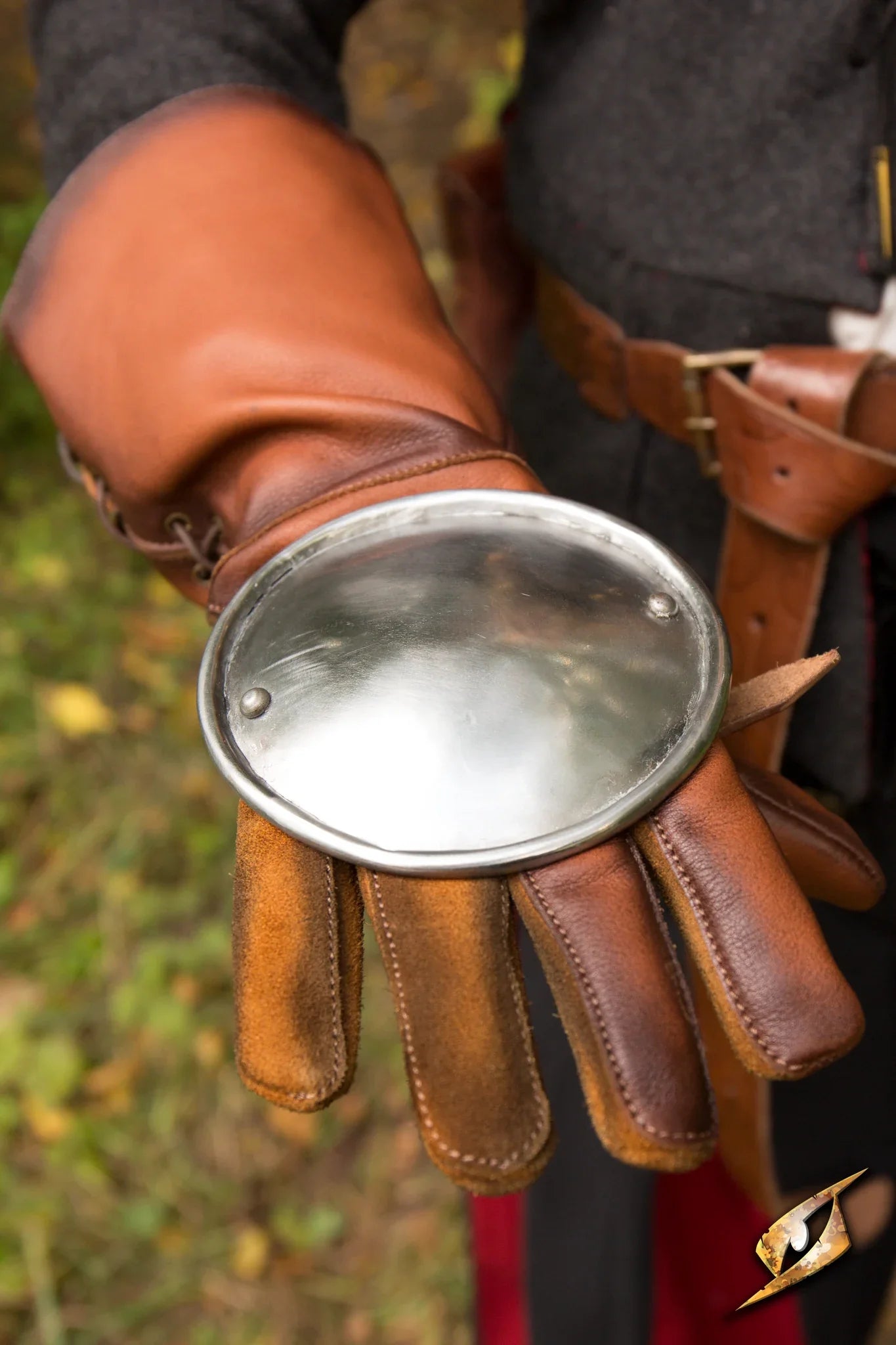 Rondel Hand Protection featuring sturdy leather gloves with a metal guard for improved fencing safety.