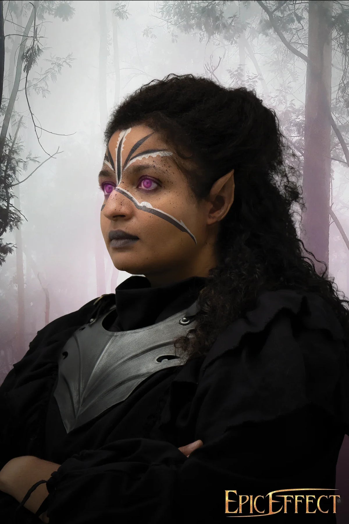 Dark Elf Ears on a character with striking makeup and a fantasy background in a misty forest.
