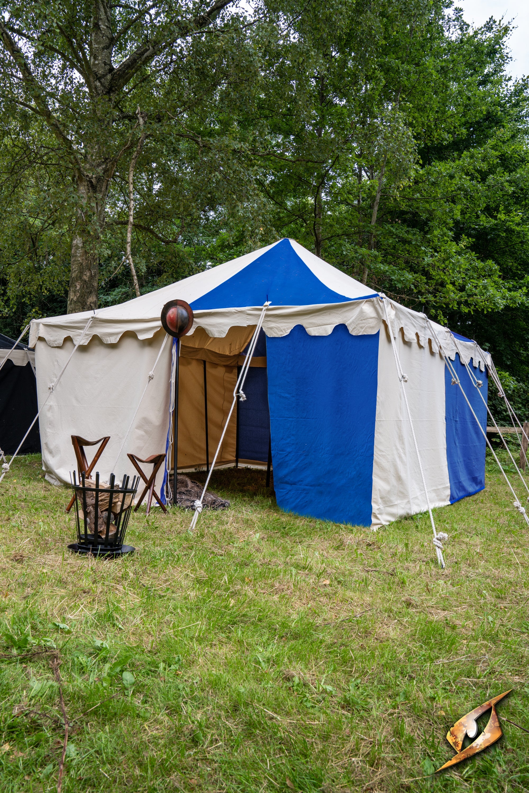 Marquee Tent - 4x4m set up in a grassy area, featuring blue and white fabric with multiple entrance flaps.