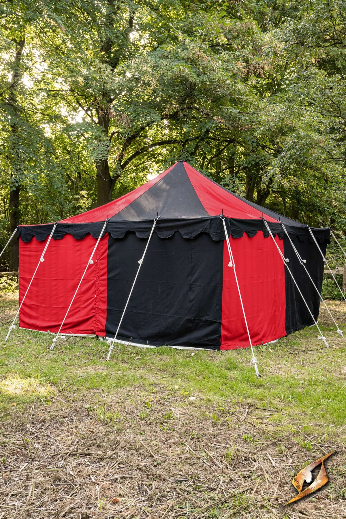 Marquee Tent - 4x4m displayed in a lush green outdoor setting with red and black fabric.
