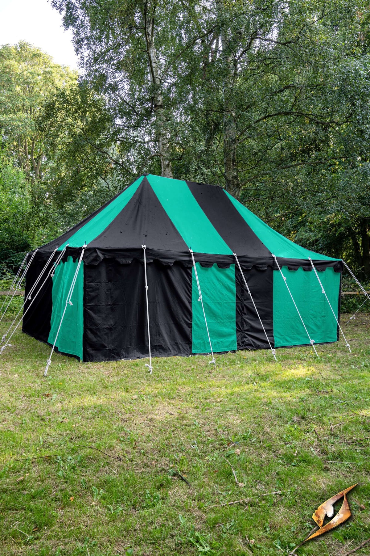 Marquee Tent - 4x6m displayed in a green and black color scheme set up in a grassy area surrounded by trees.