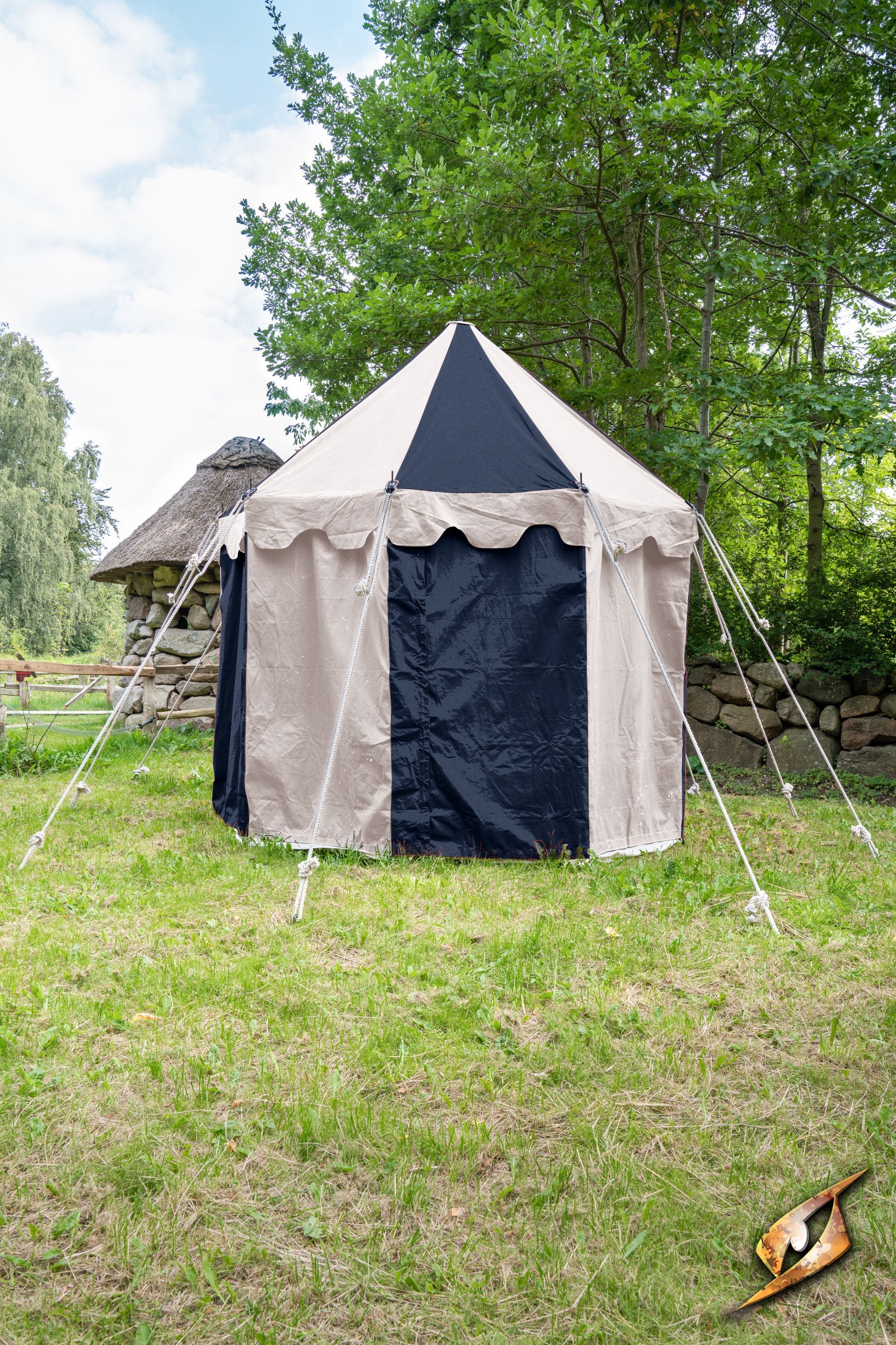 Round Pavilion Tent - 3m set up in a grassy area surrounded by trees and traditional structures.