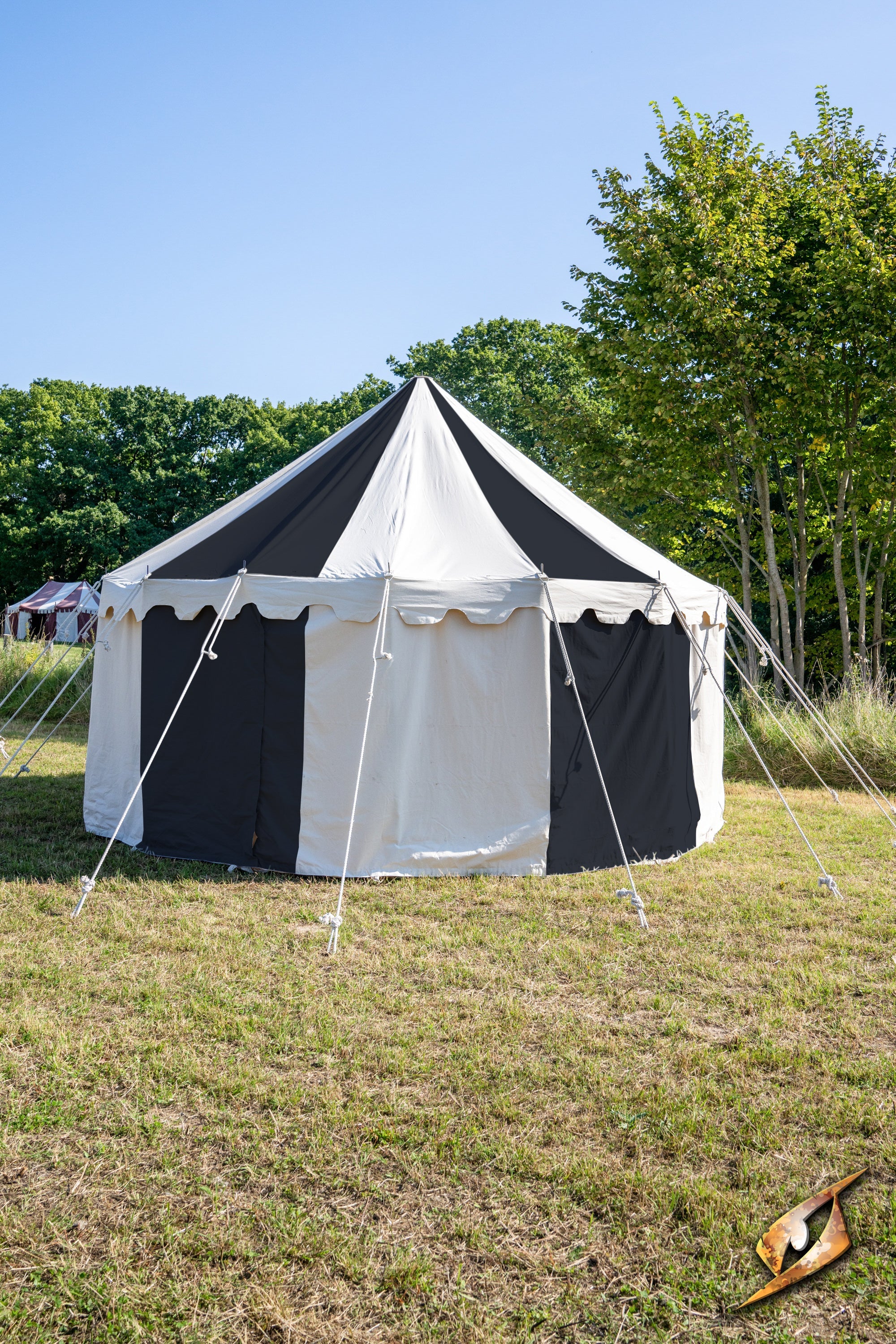 Round Pavilion Tent - 5 m displayed in a grassy field under a blue sky, featuring a black and off-white design.