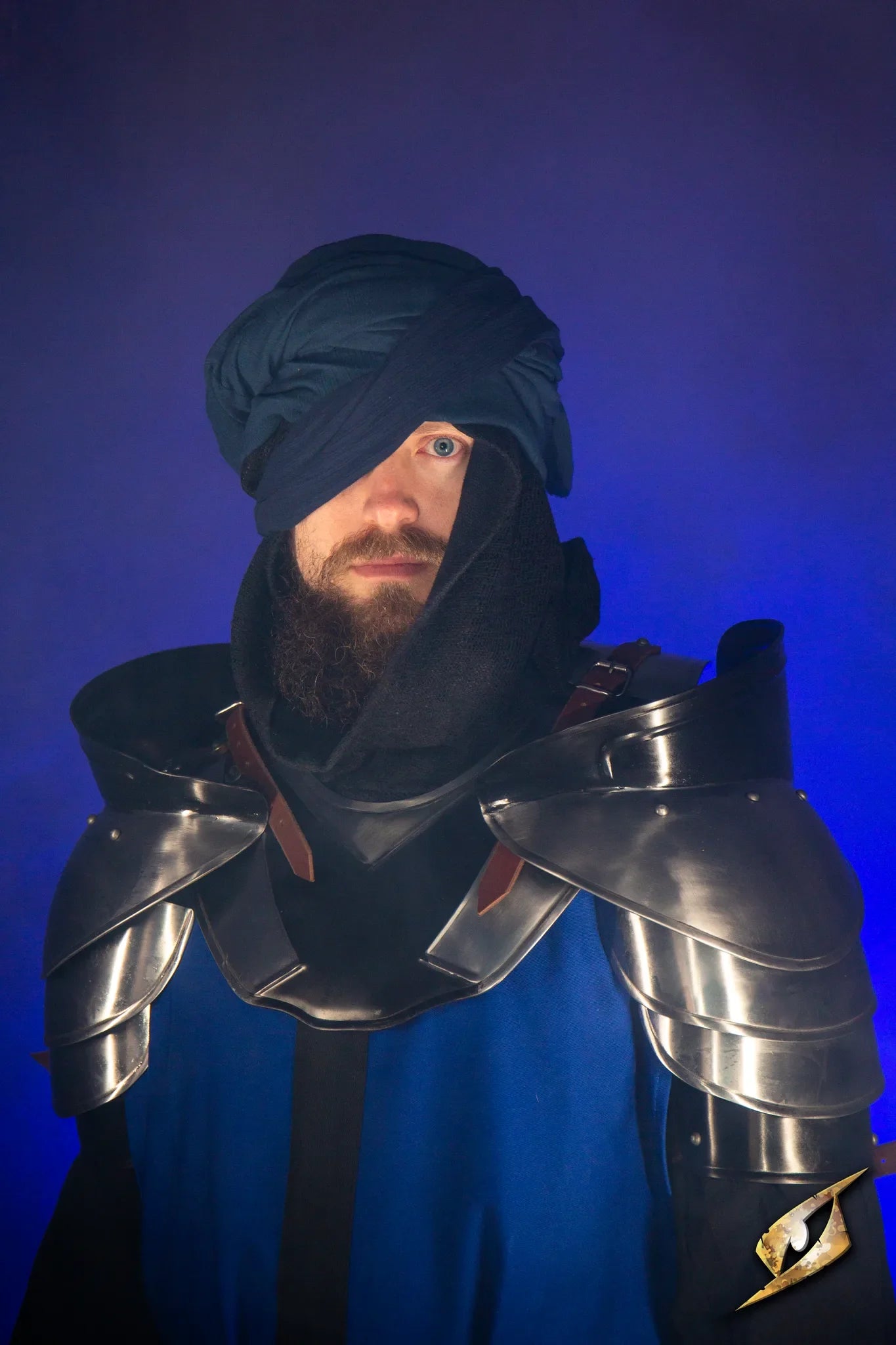 Black Ice Neck & Shoulder set worn by a warrior, featuring blue, black and silver armor with a distinctive design.