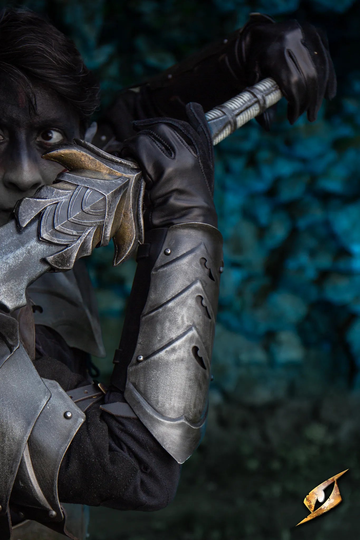A close-up of a fencer wearing Eventide Bracers, holding a sword, against a mystical blue background.