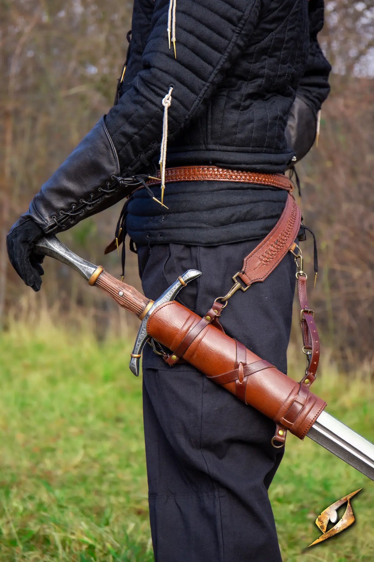 Sword Belt Hanger showcasing a sword on a belt, worn by a person in an outdoor setting.