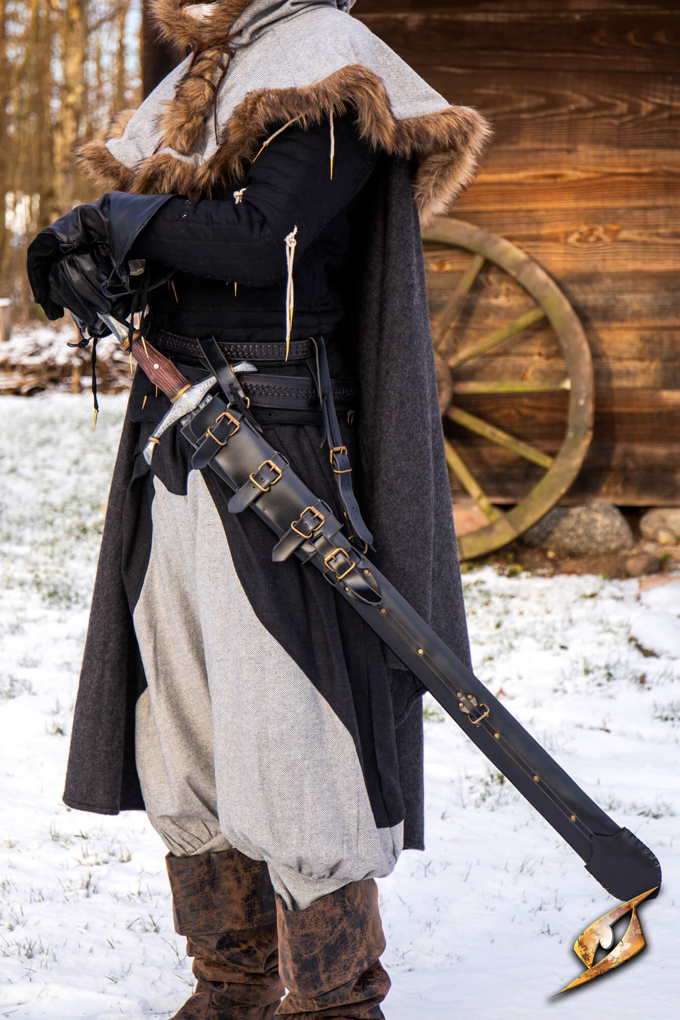 Adjustable Scabbard - Faux Leather displayed on a person in a snowy setting, showcasing its adjustable design and aesthetic.