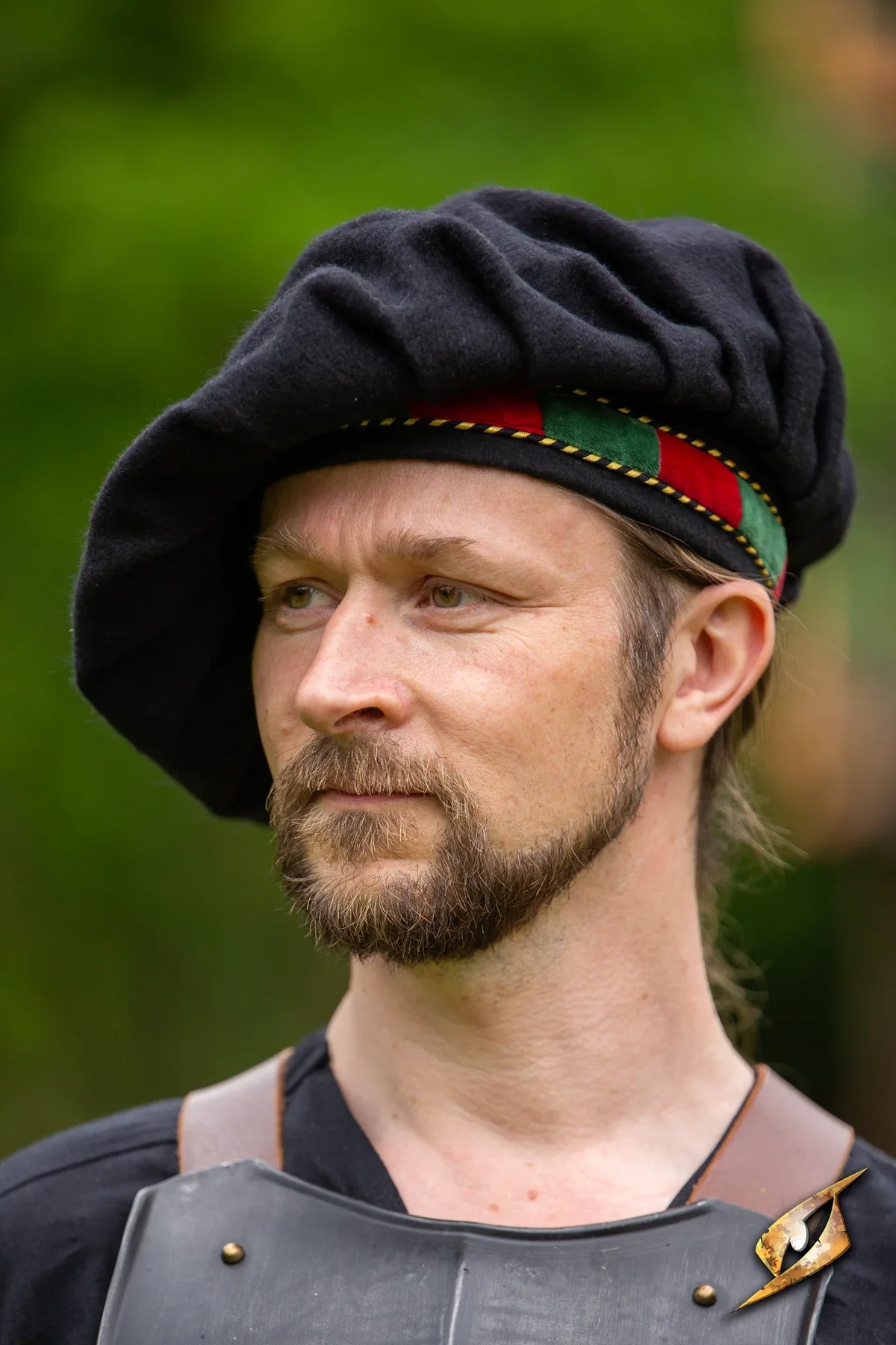 Man wearing a Wool Minstrel Hat, showcasing its unique style and historical design in an outdoor setting.