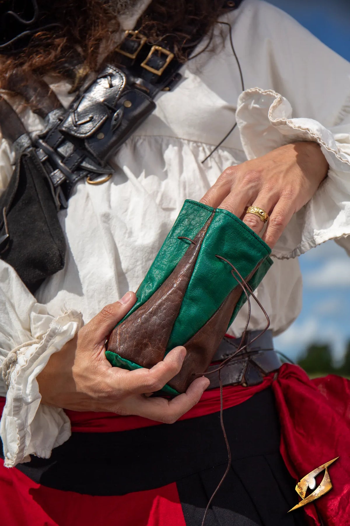 Bounty Hunter Pouch in green and brown leather, designed for carrying coins and essentials.