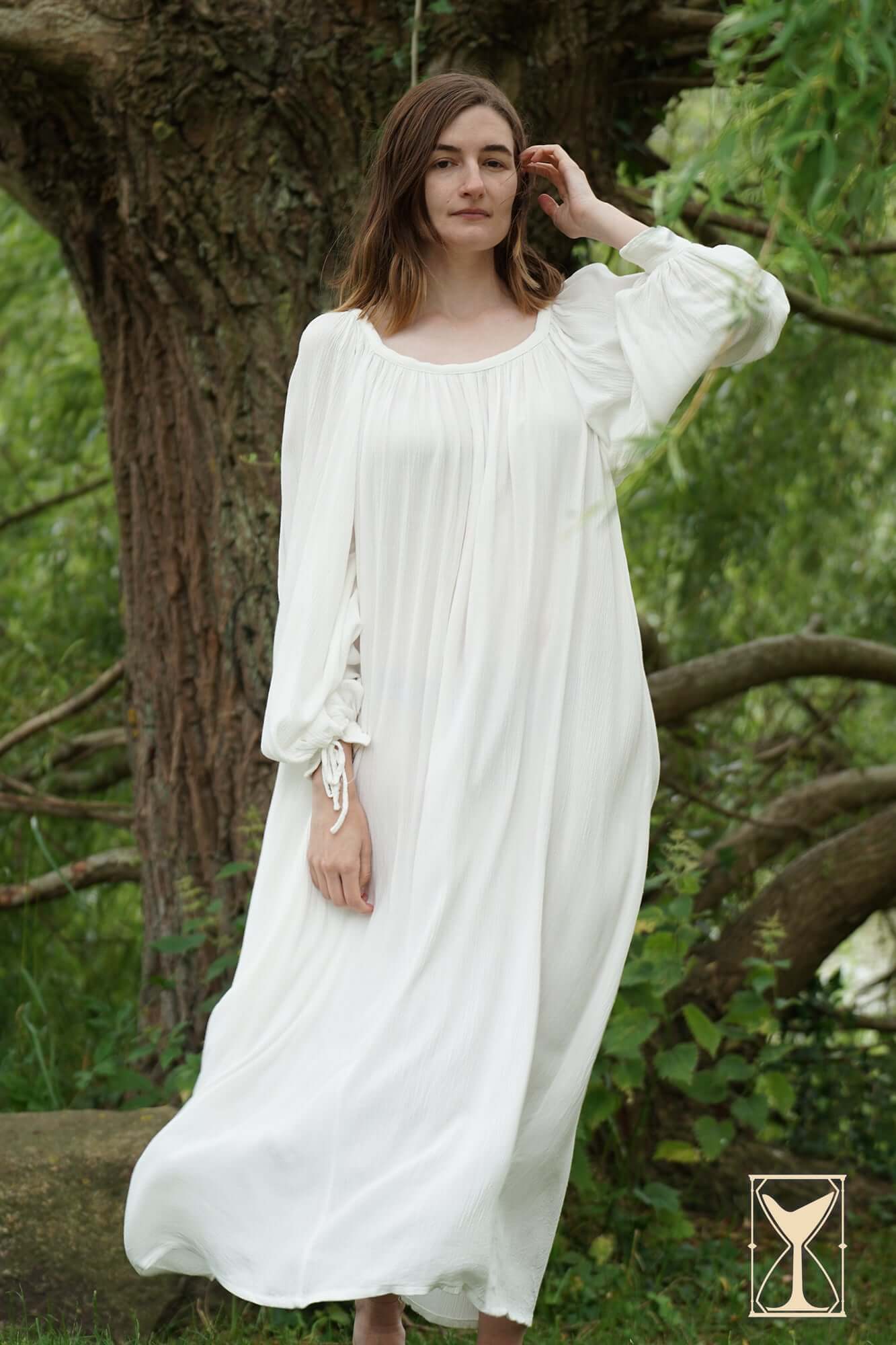 Model wearing the Shift Giulia historical costume, showcasing its elegant white design and flowing silhouette.