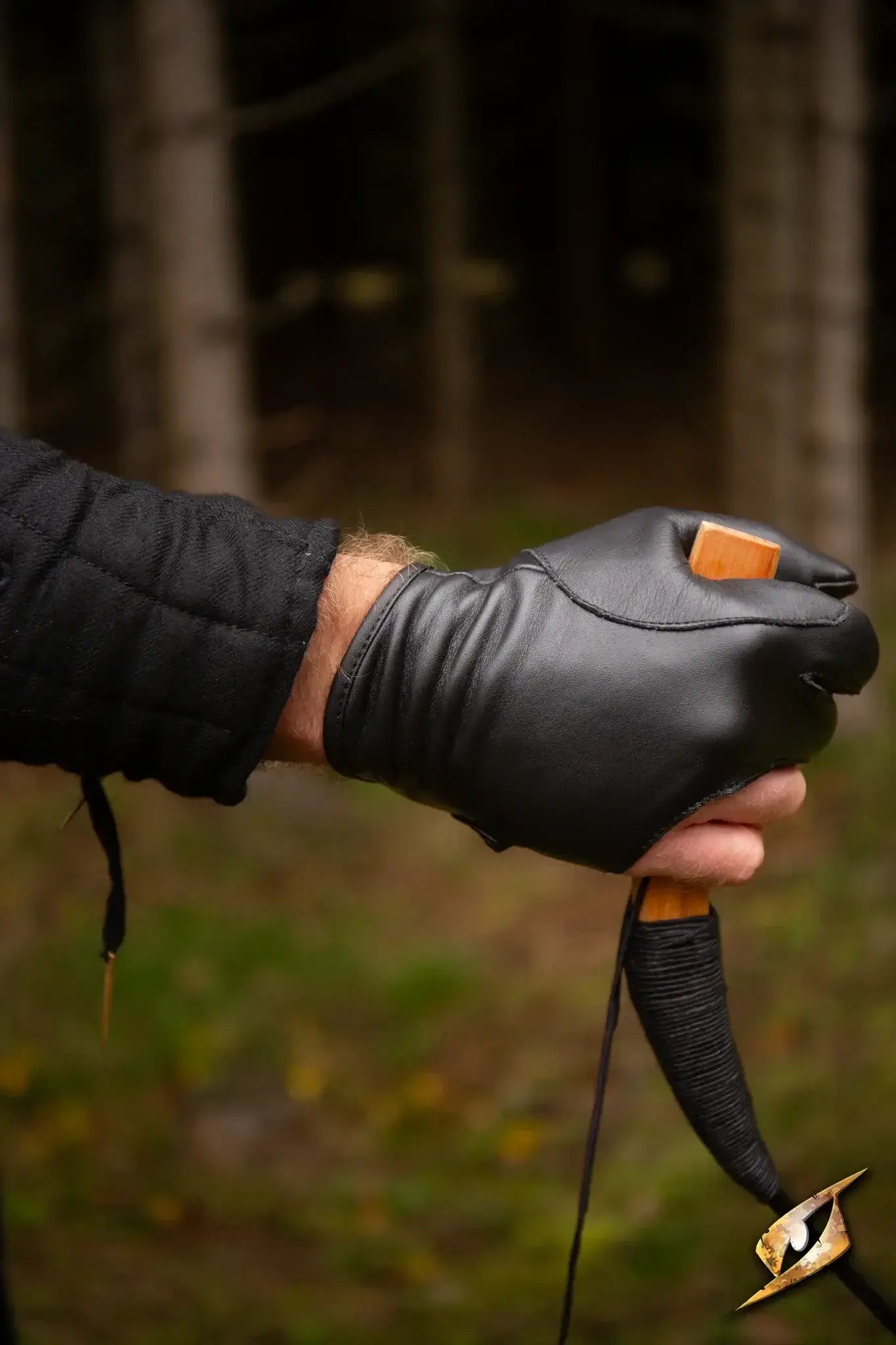 Archery Half-glove worn by an archer, showcasing precision grip and comfort in outdoor setting.