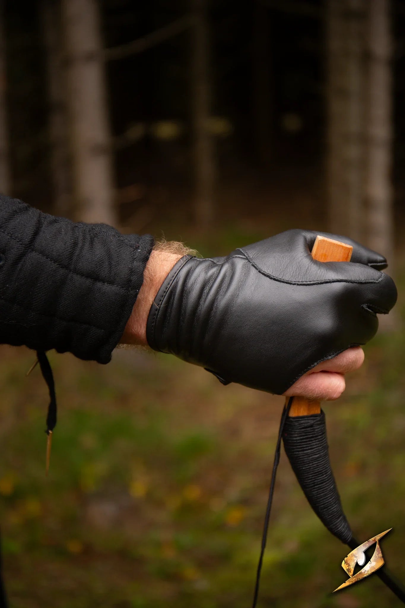 Archery Half-glove worn by an archer, showcasing precision grip and comfort in outdoor setting.