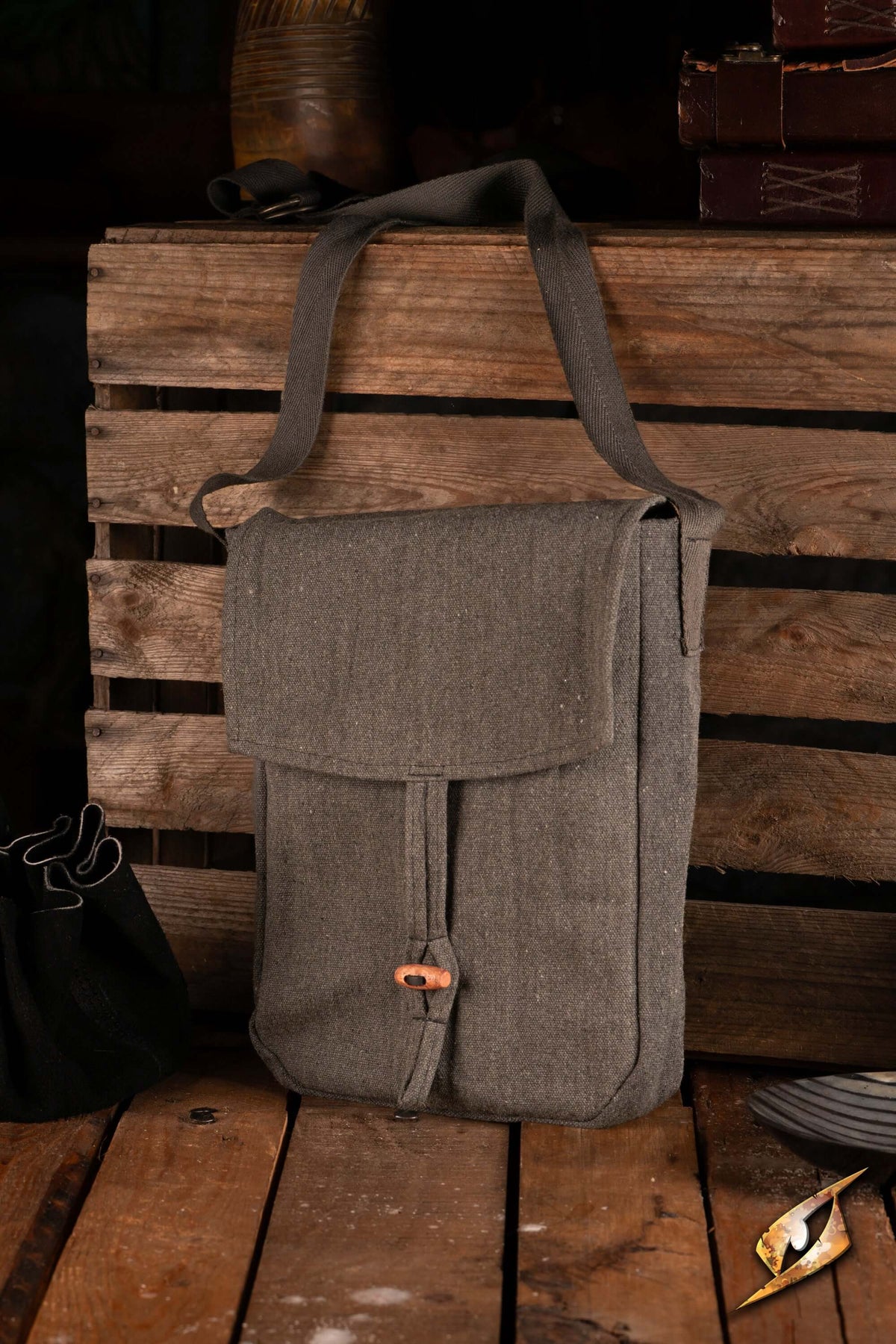 Traveler Satchel - Canvas on wooden table, showcasing its durable cotton design for outdoor adventures.