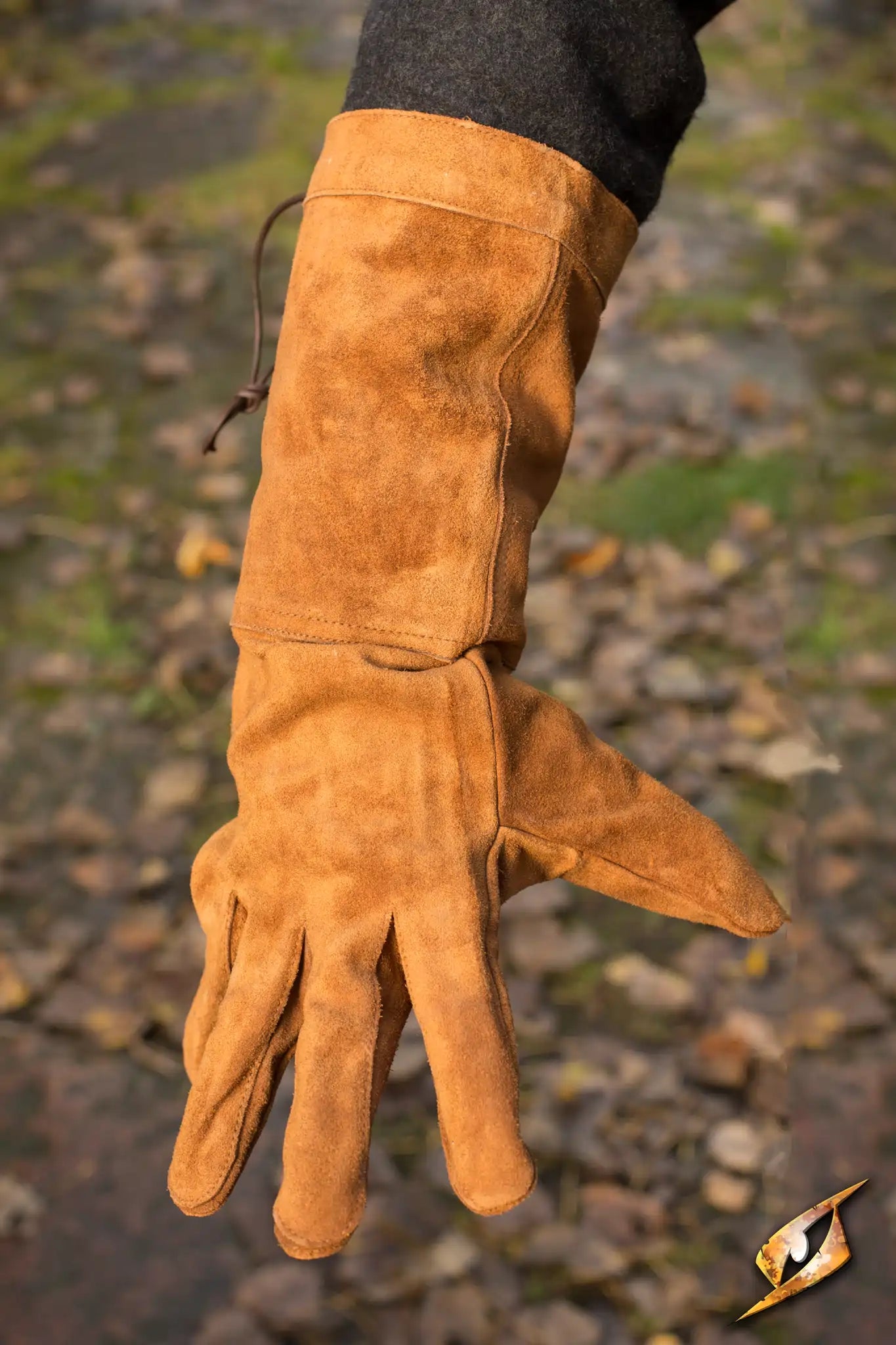 Stylish brown leather gloves displayed on a hand, perfect for outdoor activities and cold weather.