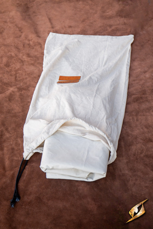 Tarpaulin Bag folded neatly in a durable storage bag, perfect for camping and outdoor adventures.