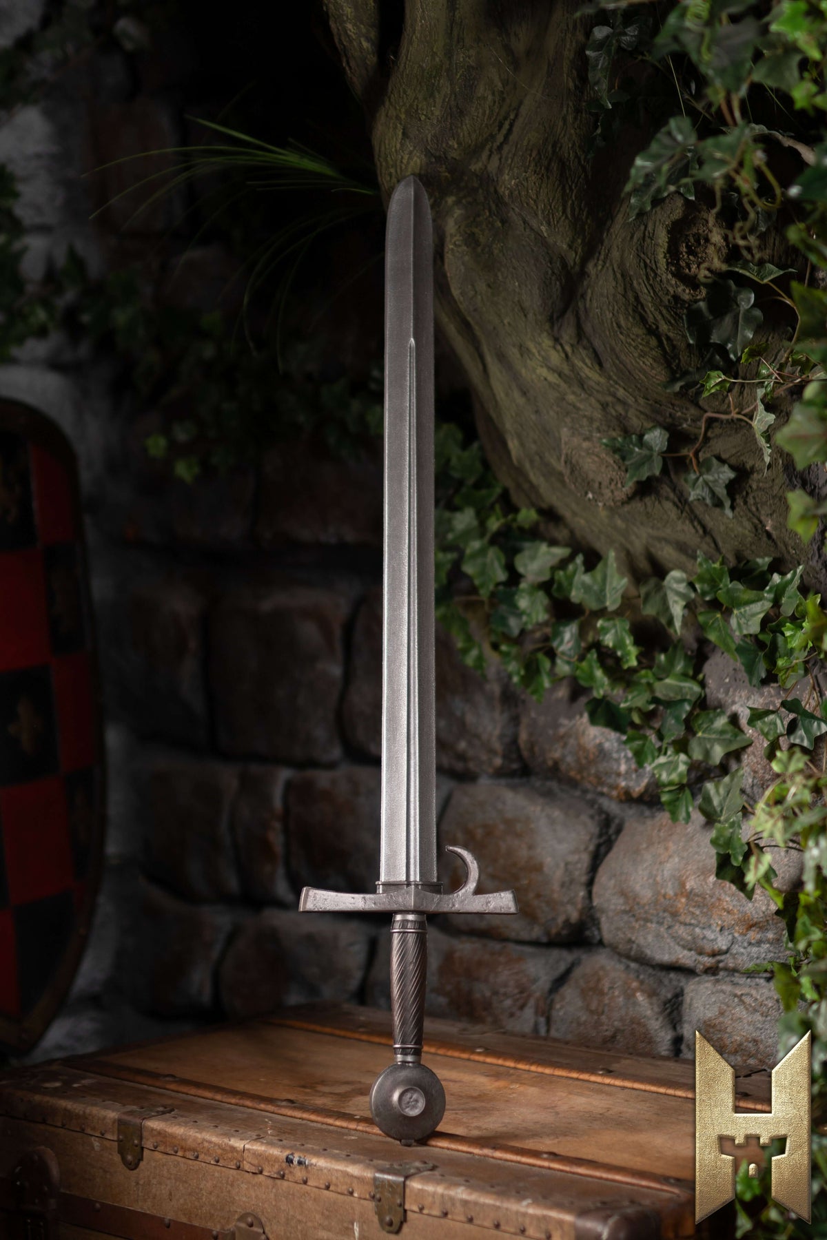 Milanese Sword displayed against a stone wall, showcasing Renaissance design and LARP construction from Epic Armoury.