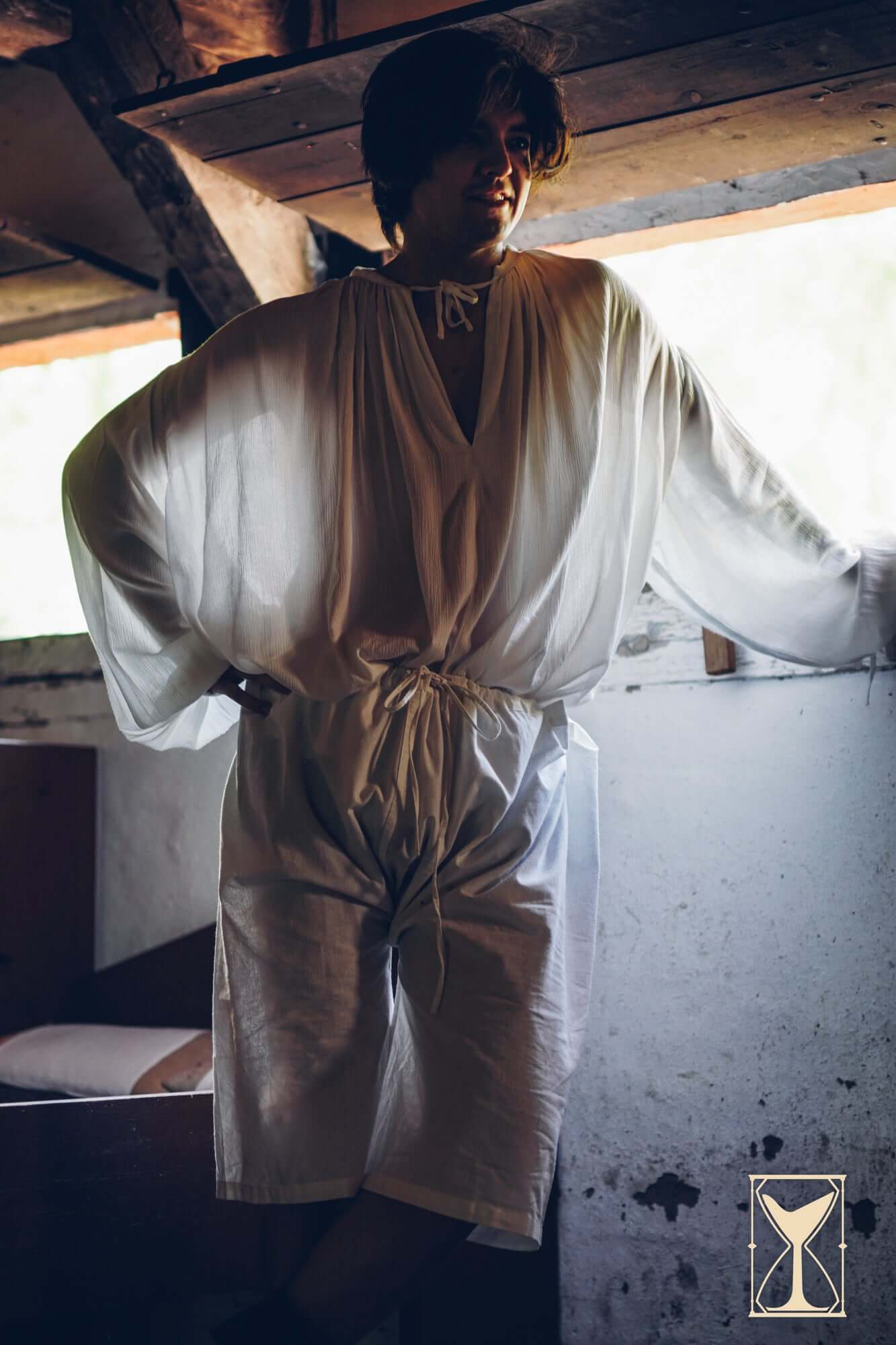 Braies - Long worn by a model in a rustic setting, showcasing medieval-inspired attire for LARPing or reenactment.