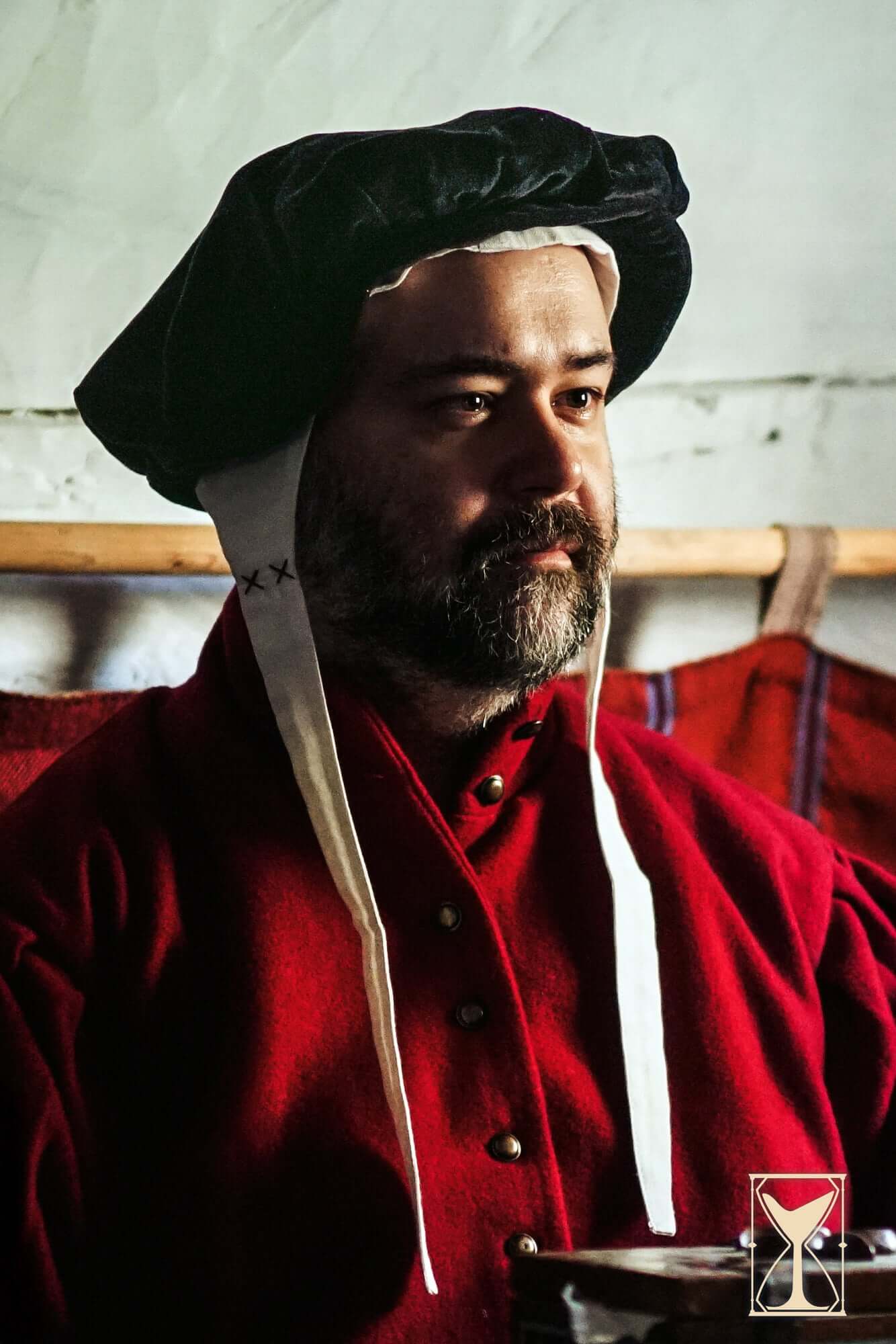 Man wearing a Beret Francisco, a velvet headpiece inspired by 15th and 16th-century fashion.