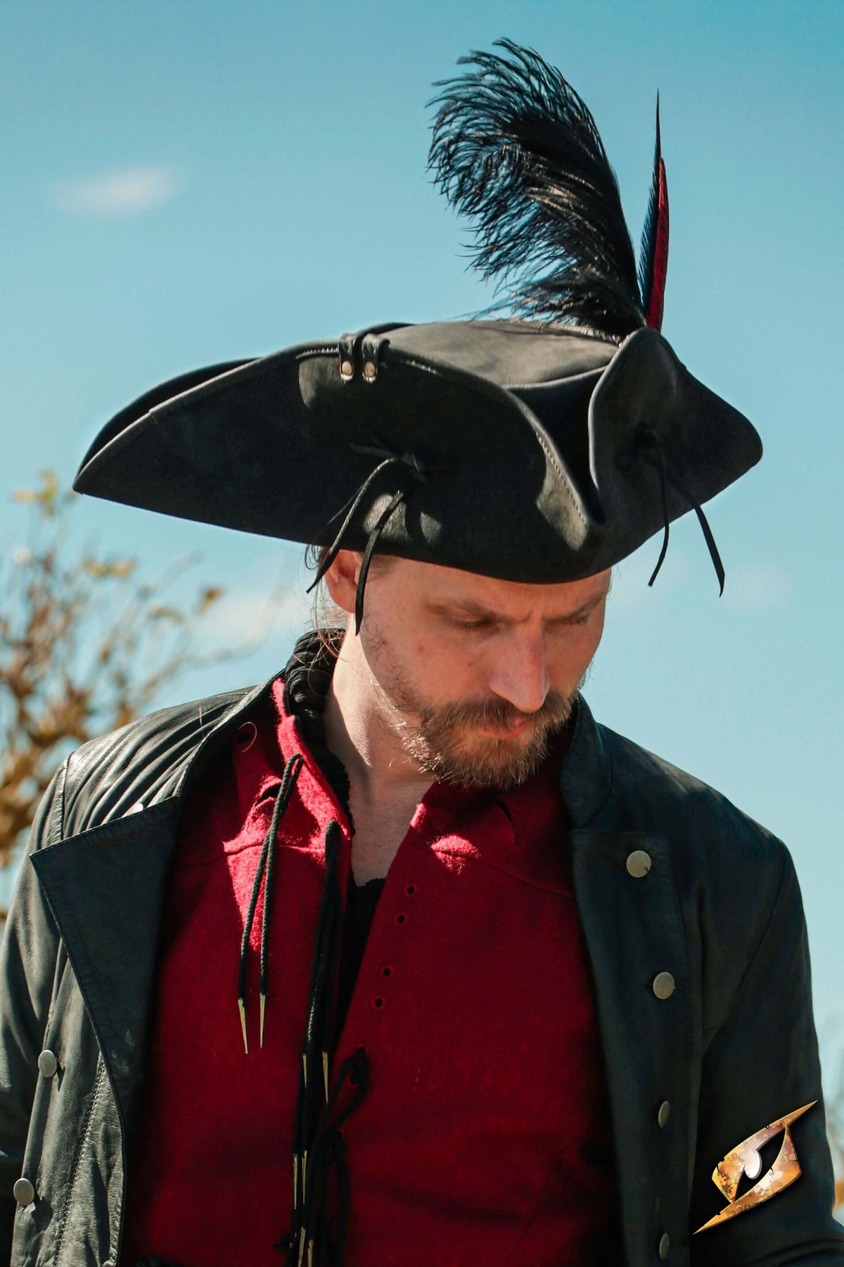 Simple Leather Pirate Tricorn Hat worn by a man in a black coat, outdoors with a plume.