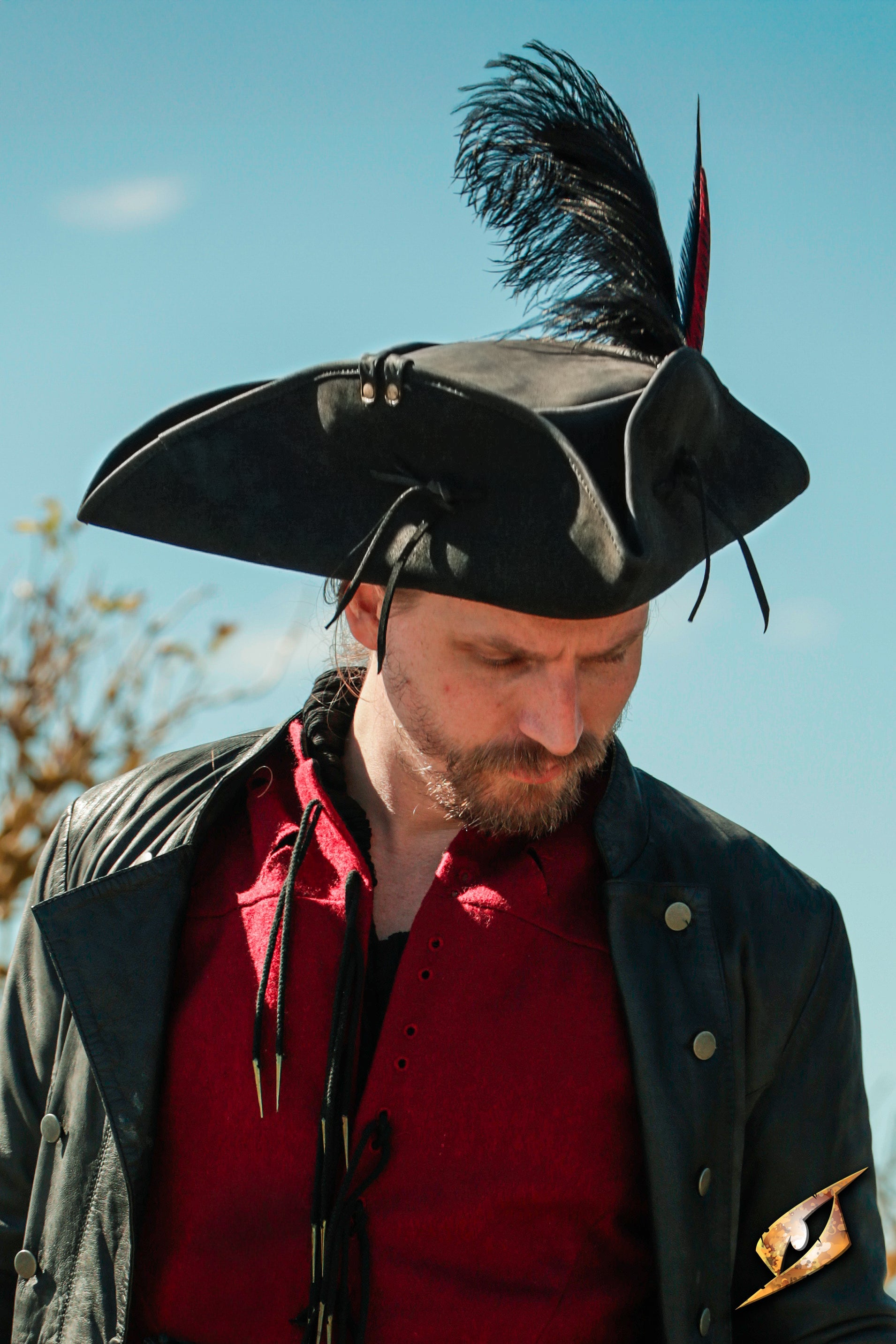 Simple Leather Pirate Tricorn Hat worn by a man in a black coat, outdoors with a plume.