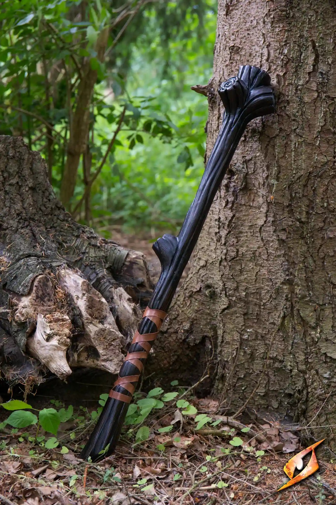 Wooden Club leaning against a tree, featuring realistic wood grain and leather-wrapped grip.
