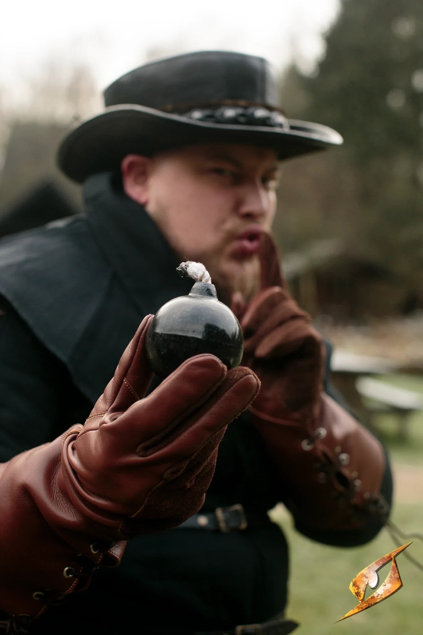 Hand Bomb held by roguish character in a dramatic pose, showcasing its realistic design and LARP potential.
