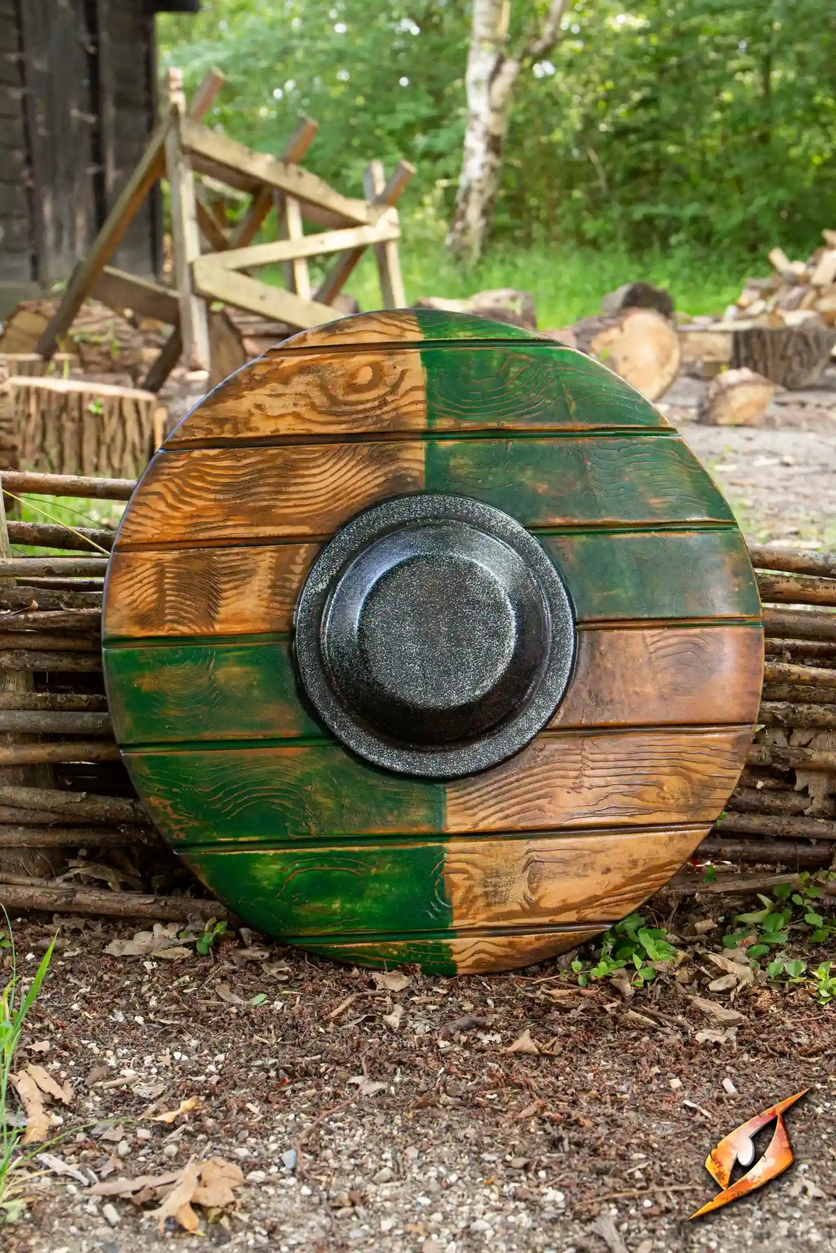 Drang Shield displayed against a rustic backdrop, featuring a textured wooden design with green and brown colors.