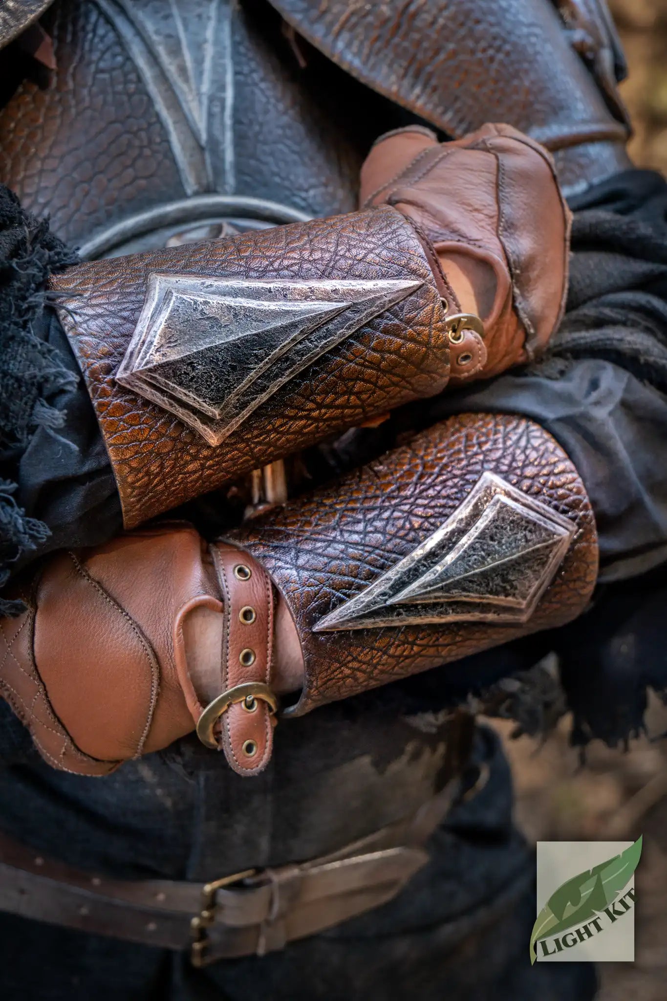 Barbarian Vambraces PU - L/XL with diamond-shaped steel accents in a LARP setting.