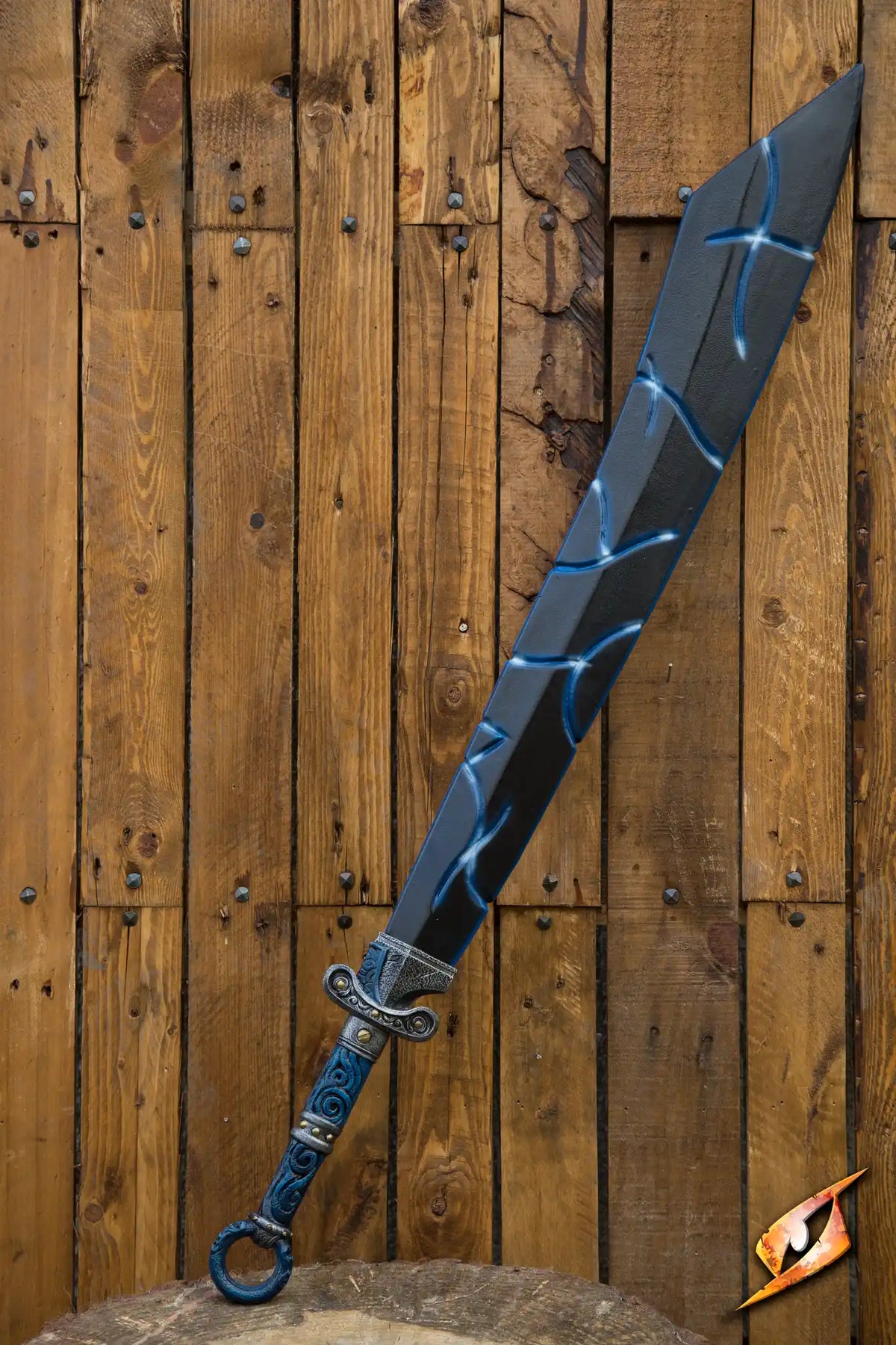 A striking Magic Dao sword displayed against a wooden backdrop, showcasing intricate designs and vibrant colors.