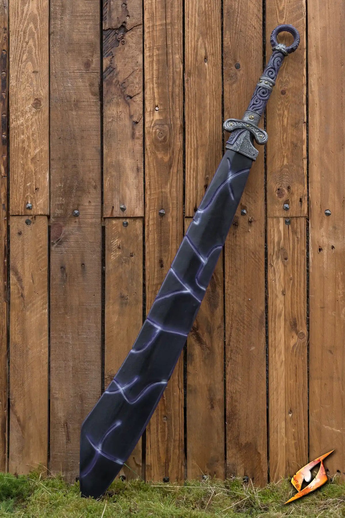 Magic Dao: a striking sword with ornate handle, displayed against a rustic wooden background.