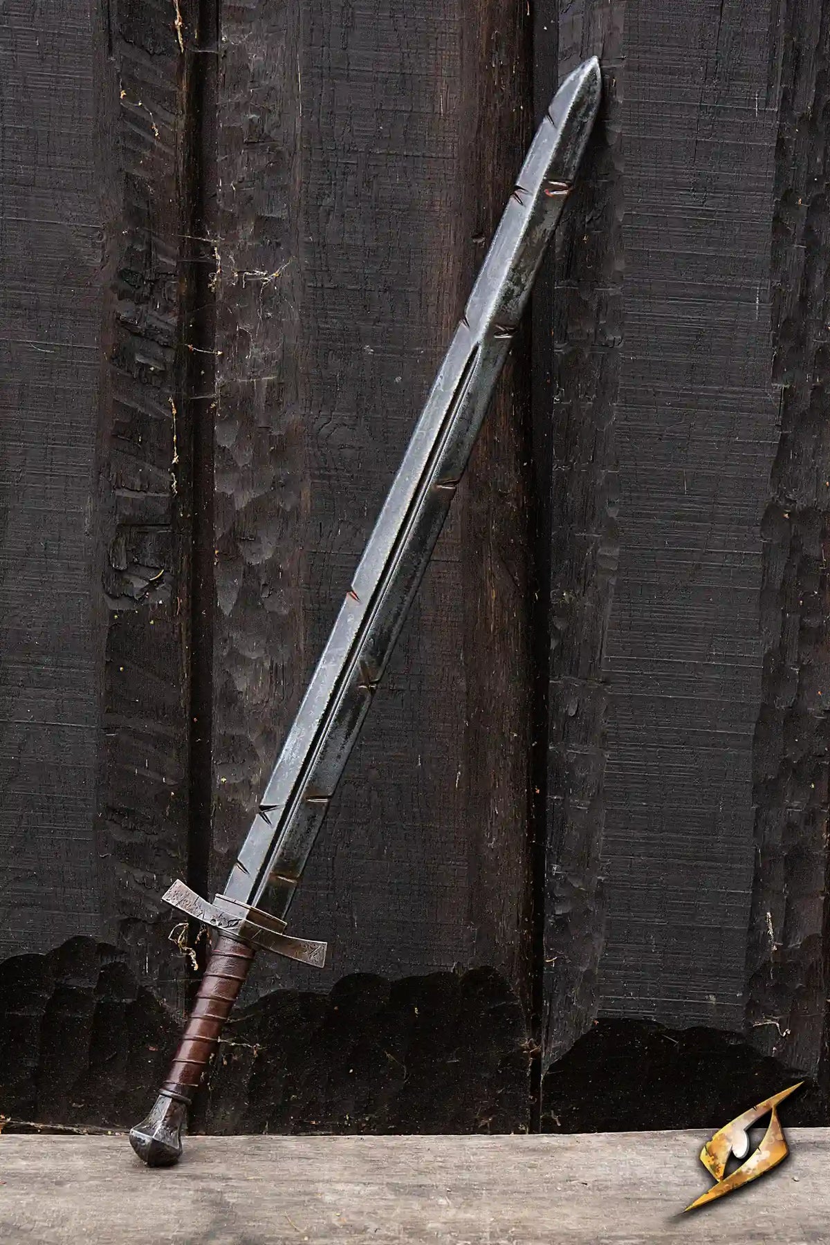 Battleworn Footman Sword leaning against a wooden background with realistic weathered details.