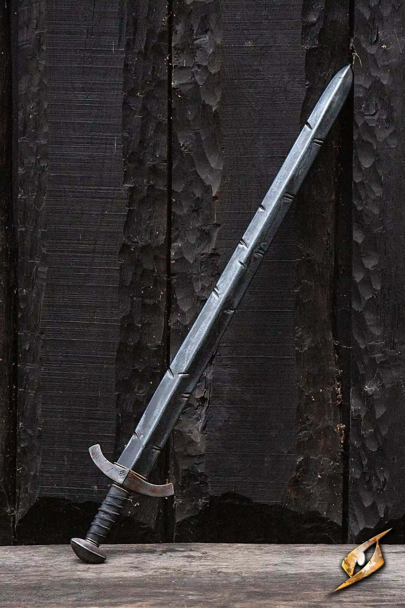 Battleworn Squire Sword displayed against a dark wooden background, showcasing its double-edged blade and detailed grip.