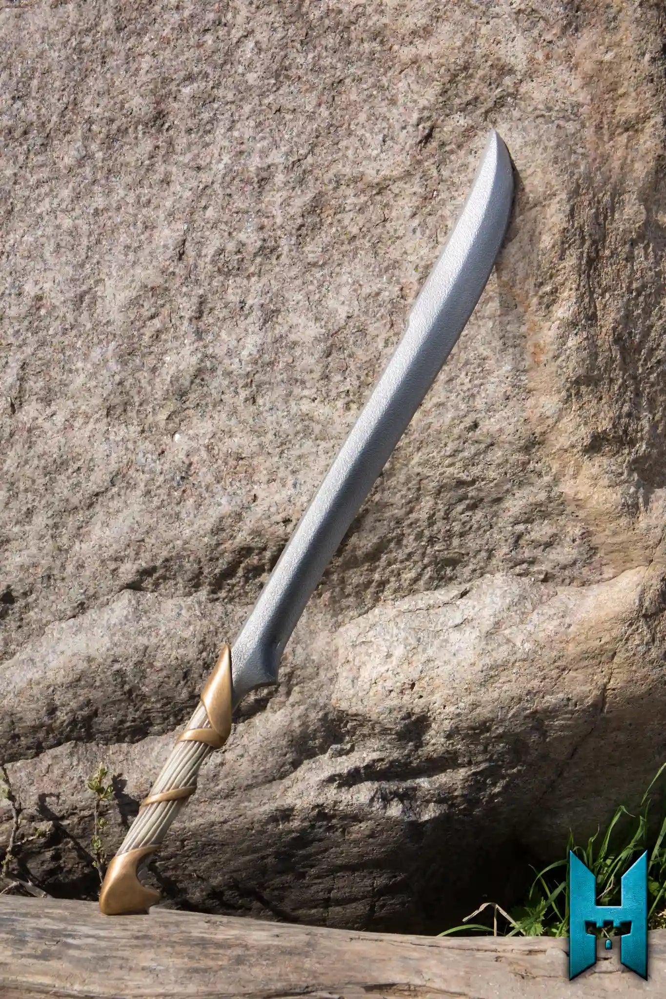 Sword Bundle featuring a sleek, metallic-looking sword resting against a rocky surface, perfect for epic adventures.